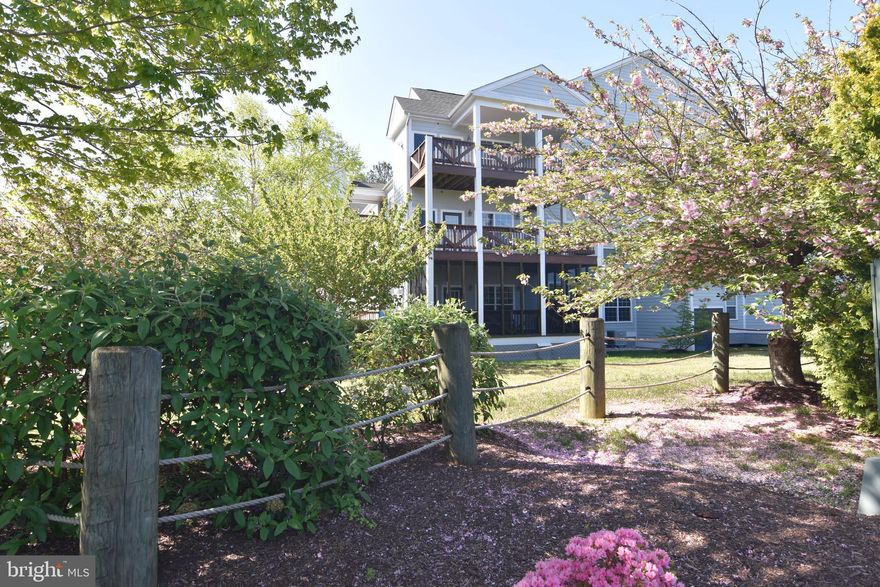 Main level condo in gated waterfront community.  Shows well & ready for new owners!  New hardwood floors in main living areas..  Freshly painted thru out. Remodeled bathrooms.  Replacement windows.  Kitchen has granite counters, island, stainless appliances, tiled backsplash & access to  large screened porch.  9' ceilings.  Gas fireplace.   Neighborhood amenities include:  Pool, tennis courts, picnic area w/ grills, kayak storage racks, gazebo, club house, fitness room, playground, pier.  Close proximity to Restaurants, boardwalk & shops.