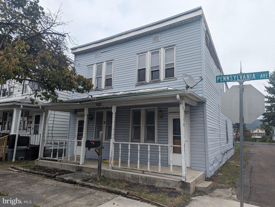 Large home that needs complete rehab. New roof installed over main area. Off street in rear of building. May be converted to duplex. All open inside.