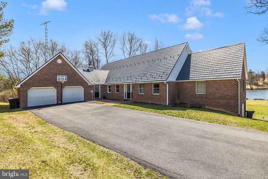 **Final offers due by Sunday 3/30 at 6pm**
IN-LAW SUITE, WATER FRONT, GOLF COURSE, LOCATION!
Welcome to 215 Twin Lakes Circle, a beautifully crafted 5 bedroom, 4.5 bathroom masterpiece nestled in the highly sought-after Howard Speaks Community. This custom-built home offers a seamless blend of luxury, comfort, and efficiency, with breathtaking views of the backyard pond and top-tier amenities throughout.

Step inside to a spacious, sunlit kitchen featuring upgraded appliances, ample counter space, and a large pantry with a convenient pocket door. Beautiful wall of windows overlooks the stunning lakefront from this favorite room of the house! The open-concept design flows effortlessly into the stunning sunroom, where large windows flood the space with natural light, providing panoramic views of the serene backyard pond—the perfect spot to relax year-round. Last spring, they installed a brand new Daikin energy efficient HVAC unit!

The owner’s suite is a true retreat, boasting its own fireplace, a charming bay window, a walk-in closet, and a spa-like ensuite with a hot tub, shower, and double sinks. (There is also a secure secret closet inside the owners suite closet too!) 

With four fireplaces throughout, this home radiates warmth and charm, enhanced by geothermal heating and UV air filters for year-round efficiency. Additional features include a Jack and Jill bathroom upstairs, a designated home office on the main level, and a mostly finished basement—perfect for extra living space.

The walkout basement offers a full in-law suite with its own kitchen, living room, dining room, and full bathroom, providing a private space for guests or extended family. A dedicated utility room with water-sealant walls ensures durability and storage solutions.

Step outside to a beautifully landscaped backyard featuring a large pond and a dedicated fire pit area, creating the ultimate outdoor retreat for relaxing or entertaining. Whether you're enjoying a quiet evening by the fire or taking in the scenic waterfront views, this space is designed for making memories.

This home is designed with both style and function in mind, featuring an upscale metal roof that offers superior durability, energy efficiency, and modern elegance. The property also boasts an oversized 2-car garage with a spacious loft for additional storage and a lower-level oversized 1-car garage for added convenience (attached to the in-law suite)

Enjoy scenic views, modern upgrades, and an unbeatable location in this one-of-a-kind property. Don’t miss your chance to call this exquisite beauty home!