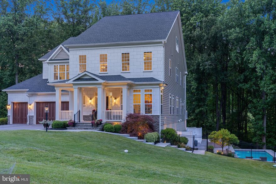 Welcome to your extraordinary retreat! This HGTV-inspired modern farmhouse masterpiece is a testament to timeless elegance and contemporary design. Built less than six years ago, this sprawling residence spans over 7000 square feet, offering abundant space for every aspect of your lifestyle. Nestled amidst a picturesque neighborhood, this home is a tranquil oasis, enveloped by majestic aged trees and natural preserves. Step inside and be greeted by the luxury wide plank wood floors that grace the entire main level, adding a touch of rustic charm to the modern aesthetic. The centerpiece of the living room is the wood-tiled fireplace, showcasing intricate craftsmanship and providing a cozy focal point for gatherings. Indulgence knows no bounds in this lavish home, boasting five bedrooms, each accompanied by its own dedicated en-suite. The upstairs owner's suite is a sanctuary of opulence, featuring a full sitting room and dual walk-in closets. Meanwhile, the main level presents an in-law suite with two spacious walk-in closets, ensuring comfort for every member of your household. Entertainment options abound in this remarkable abode. Find refuge in the cozy movie theatre, complete with plush seating and a full Bose surround sound system, creating a cinematic experience in the comfort of your own home. Stay fit and motivated in the private gym, equipped with state-of-the-art exercise equipment and a large TV to keep you entertained during workouts. The heart of this home lies in the exquisitely designed kitchen, where culinary delights come to life. Adorned with high-end appliances and quartz countertops, this kitchen is a chef's dream. With a large island perfect for hosting parties and a convenient walkout to the porch, entertaining guests has never been easier. Experience the ultimate convenience with smart features, including automated blinds in the kitchen, family room, and the upstairs owner's bedroom. Find inspiration and focus in one of two closed and private office spaces, bathed in natural light and thoughtfully designed for professionals and remote workers. Stay ahead of the curve with the active EV charger port in the garage, catering to eco-conscious homeowners. For those seeking ultimate relaxation, the lower level is rough-in ready for a wet bar, promising endless possibilities for creating your own personal retreat. Unwind after a long day in the saltwater pool, complete with cascading waterfalls that create a soothing ambiance. Gather around the gas-powered fire pit, perfect for cozy evenings under the starlit sky. Challenge your friends to a friendly game on the sports court, featuring a basketball hoop and a bounce-back net. Don’t miss your chance to own this architectural marvel, where luxury and functionality intertwine seamlessly. Your dream home awaits, combining modern farmhouse charm with the amenities of a luxury estate.