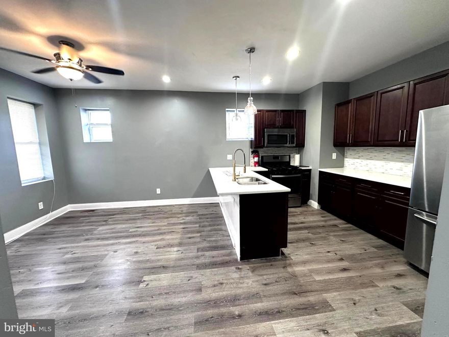 Come rent this beautiful updated bottom floor apartment that features 4 full bedrooms and 3 full bathrooms.  From the time you enter the unit, you are greeted by beautiful vinyl floors in the main areas which features a large gourmet kitchen and the main living area.  This unit has two levels, the top level features 2 bedrooms and 1 bath while the second levels features 2 beautifully tiled bedrooms with each their own bathrooms, full closets and ceiling fans.  This unit has its own washer and dryer, access to the yard, new kitchen cabinets, stainless steel appliances and granite countertops.  Please inquire about the additional storage space. Minutes from Penn North Station, rte 83, rte 40, buses 86 & 22.  The location is perfect! Come visit this beautiful unit today, you will not be disappointed!
Unit 2 is also available for rent - please inquire for more information.