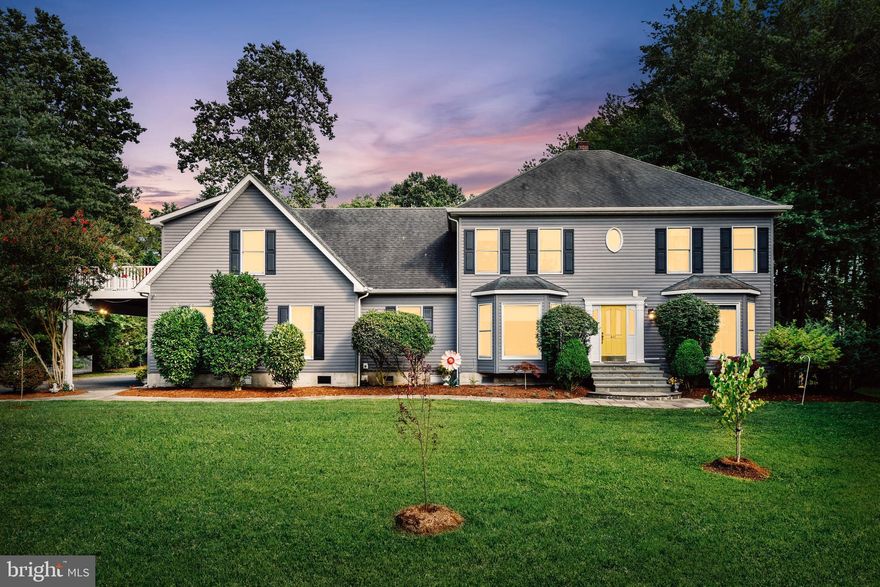 From the moment you drive up, you will see the attention to detail in your custom-built home located on a private lot  just steps from the bay. Fantastic layout! The flexible layout provides multiple spaces for home offices, au-pair wing, homeschooling, or multi-generational living. Click on the virtual tour to see an interactive floorplan highlighting the different spaces with the modern family in mind.  The main level offers two bedrooms. One bedroom has an attached family room and bathroom creating the perfect space for your nanny, college student learning online, or in-law suite. There is a second owner s suite on the upper level with a recently renovated bathroom.  The claw-foot tub, heated towel rack, oversized shower, and custom cabinetry showcase no detail was overlooked during the design. The upper-level bonus room is large enough for a massive home office, playroom, family room, homeschooling room. The room s private deck is ideal for your outdoor coffee break after a zoom call..  Your Grand living room with fireplace showcases your large backyard. Walk onto your oversized deck from the living room and listen to the sounds of nature surrounding you. Your private backyard creates an oasis to safely entertain outdoors. Does your dream backyard include a vegetable garden, play structures, chickens, shed, flowers, firepit, and an oversize 2+ car garage? This is cul de sac living at its finest. Located in the water-privileged community of Bay City where you have a private beach, kayak launch, fire pit, pavillion, and waterfront common spaces.  Plenty of options to watch AMAZING sunsets over the bay bridge. This is the ultimate,  'vacation where you live',  home. It is the first exit off the bridge, making commuting a breeze. BWI, Annapolis restaurants, and DC are a quick drive. Matapeake Schools!