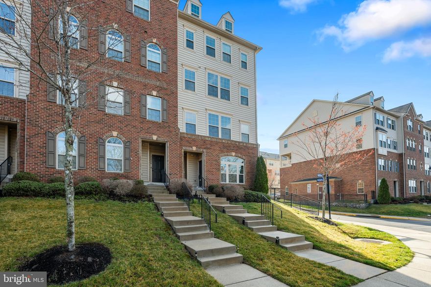 Welcome home to Virginia Manor at Dulles Farms! This well-maintained townhome offers a thoughtful layout with gleaming hardwood floors and an inviting open floorplan. Inside, your kitchen impresses with sleek granite countertops, modern stainless steel appliances, a chef's pull-out faucet, and an abundance of rich wooden cabinetry. A peninsula breakfast bar opens beautifully into the dining area, which flows seamlessly into the sun-filled living room, perfect for both casual gatherings and elegant entertaining. Upstairs, the primary suite features plush carpeting, two generously sized walk-in closets, and a handsome en suite bathroom that includes a wide double sink vanity and step-in shower. Two additional bedrooms with soft carpeted flooring - one with a private balcony perfect for morning coffee - share a well-appointed hall bath. Practical conveniences include bedroom-level laundry with utility sink and dedicated cabinet storage, plus a one-car garage with rear access and additional driveway parking. Your HOA fee covers an impressive array of services including lawn care, snow removal, water, and trash, while the community itself offers an outdoor pool, tot lots, walking paths, and a community center ideal for gatherings and events. Just minutes to Harris Teeter, Giant, Dulles Town Center, One Loudoun, Dulles South Recreation Center, and Dulles Airport. Quick access to Route 50, I-66, Braddock Road, Route 15, Dulles Toll Road, and the Fairfax County Parkway. Schedule your showing today and discover the perfect blend of comfort and convenience!