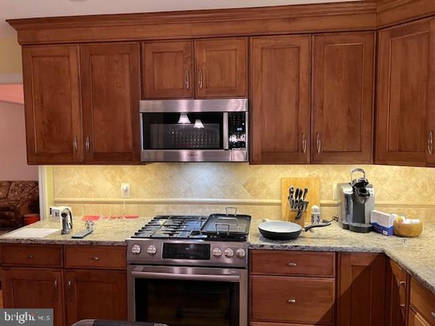 Beautiful 4 Bedroom, 2 1/2 Bath spacious 2672 SF 2-story home*Remodeled custom kitchen with cherry cabinets, tile backsplash, granite countertops, pantry with pullout drawers, center island/breakfast bar*SS appliances*Kitchen opens into FR with HW floors and cozy gas fireplace*Crown molding*spacious Formal DR/LR*1st floor Study/Office*1st floor Laundry Room*Owners Suite features walk-in closet plus 2 double closets & private bath*New carpet & padding on 2nd floor*Tankless Hot Water Heater, Water Softener, Gas Heat, newer Central A/C*Private rear yard  & L-Shaped stone patio that overlooks open space*Utility Shed included*Large Front Porch *Two-Car Garage*Immediate Occupancy