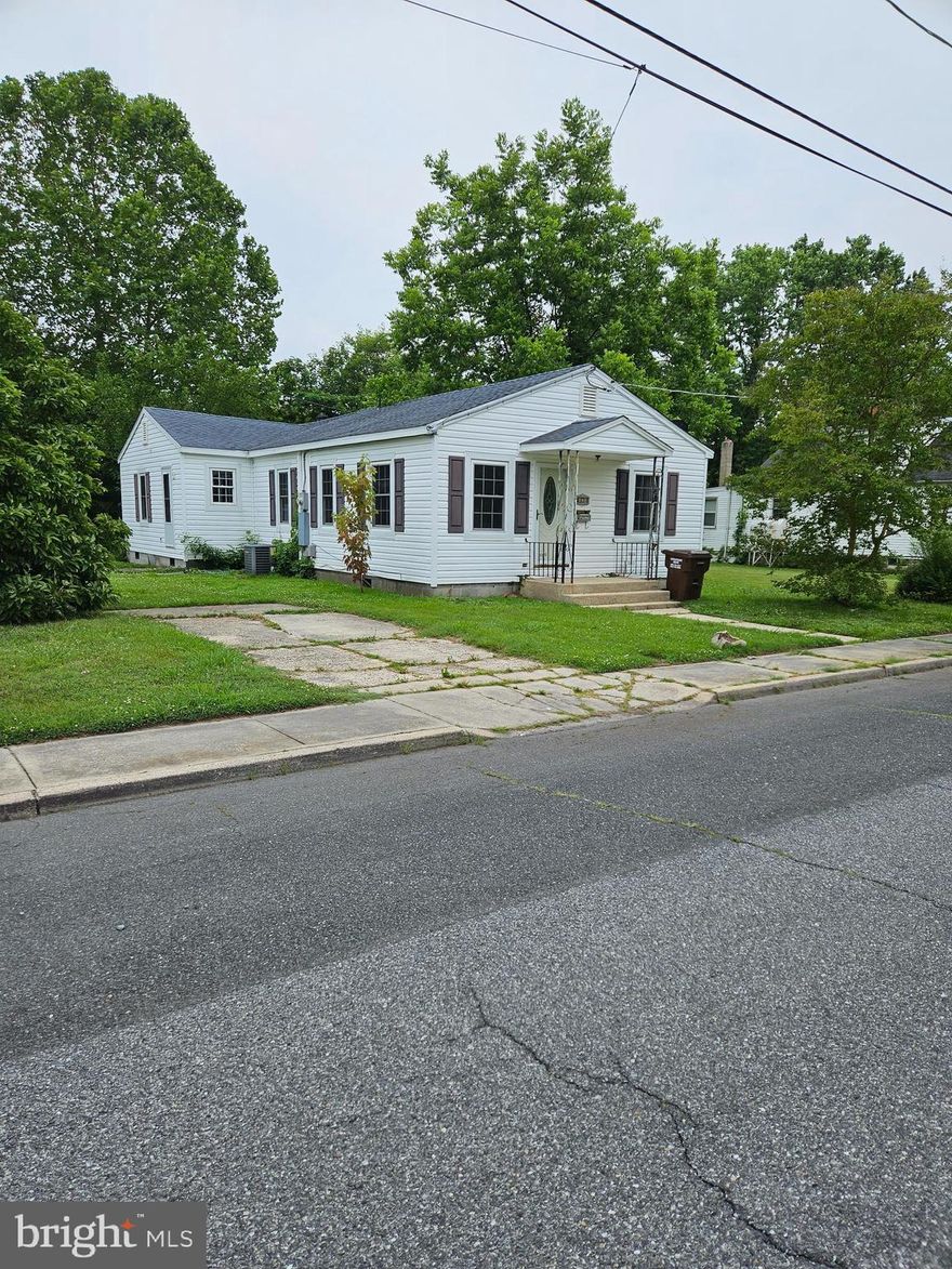 Perfect for that certain someone who wants to do a little TLC!  Under the laminate floors are the original hardwood floors that could easily be restored.   Newer tilt-in windows,  pull down attic with mostly floored space.  Back bedroom has walk-in closet.  Linen closet in hallway.  Large family room is an addition to the original house with a wood burning fireplace.  Partially fenced back yard, extra lot (Parcel 335) which is .103 acres is included for a total of .206 acres.  Concrete driveway to give you off-street parking.  
FLOOR IN UTILITY ROOM HAS SOFT SPOTS  - PLEASE BE CAREFUL!  Water and electric are turned off.
Selling in "AS IS" condition.