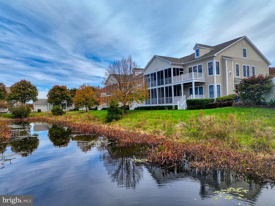 Location is everything—and this beautiful beach condo in the Village of Bear Trap Dunes delivers! Overlooking a peaceful pond, this home features a screened porch and sunny deck with new low-maintenance decking (2025)—the perfect spot for morning coffee or an evening glass of wine. Inside, you’ll find fresh new flooring, a neutral color palette freshly repainted in 2025, and a spacious, light-filled layout designed for easy coastal living. With 3 bedrooms and 3 full baths, including a primary suite with ensuite bath and a second-floor loft with its own full bath, this condo provides flexible space for guests or a home office. The vaulted great room features soaring ceilings and a gas fireplace, creating an inviting gathering area for every season. Major updates ensure peace of mind and comfort, including a new HVAC system (spring 2025) and a new roof (October 2025). A rare large walk-in attic provides excellent storage for beach gear, golf clubs, and seasonal items. Even better, the home is being sold partially furnished, making it easy to move right in and start enjoying your beach retreat from day one. Just 3 miles from downtown Bethany Beach and the boardwalk, the premier community of Bear Trap Dunes offers a true resort lifestyle. Residents enjoy both indoor and outdoor pools, a homeowners-only pool, and the award-winning 27-hole Bear Trap Dunes golf course. The seasonal beach shuttle makes getting to the beach or downtown Bethany effortless. Enjoy a wealth of amenities, including pickleball, tennis, volleyball, and basketball courts, a fitness center, tot lot, and miles of scenic walking paths. After a round of golf or a day in the sun, relax at The Den at Bear Trap Dunes, the on-site restaurant and pub with a beautiful terrace overlooking the course—perfect for dinner or sunset cocktails with friends. Bear Trap Dunes offers the ideal blend of coastal tranquility, resort-style amenities, and convenience, making it one of the most sought-after communities near Bethany Beach.