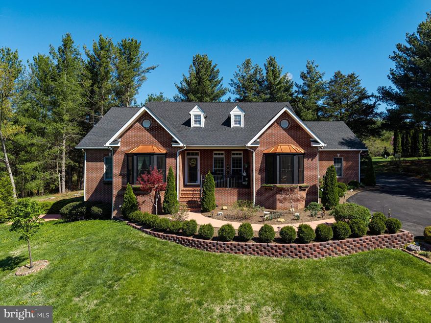 This exquisite detached all brick residence, nestled within the prestigious Cliffside community, offers an unparalleled blend of luxury and comfort. Built in 2003, this meticulously maintained property spans over 4,000 square feet and sits on a generous 2.23-acre lot, providing ample space for both relaxation and entertainment.
Step inside to discover a sophisticated interior featuring a traditional floor plan adorned with hardwood and tile flooring. The gourmet kitchen is a culinary enthusiast's dream, equipped with upgraded countertops, an island, and a spacious breakfast area. The adjoining dining area (main level) and wet/dry bar (downstairs) enhance the home's entertaining potential. The primary suite boasts a lavish bathroom with a whirlpool tub and walk-in closet, providing a serene private retreat. Additional highlights include a cozy gas fireplace and an inviting screened-in porch.
The mostly finished basement offers additional living space with a walkout level, perfect for hosting guests. Outside, the meticulously landscaped grounds feature exterior lighting and a patio, while private access to the Shenandoah River allows residents to indulge in fishing and swimming for an elevated lifestyle experience. The attached side-entry garage accommodates two vehicles, complemented by a private asphalt driveway.
Recent improvements within the last five years further elevate the property’s value and peace of mind: a new roof, tankless hot water heater, installed whole-house generator, new bay windows, and the removal of more than 100 trees to open up stunning mountain views.
This residence epitomizes high-end living, combining elegant design, thoughtful upgrades, and exceptional amenities for a truly exclusive lifestyle.