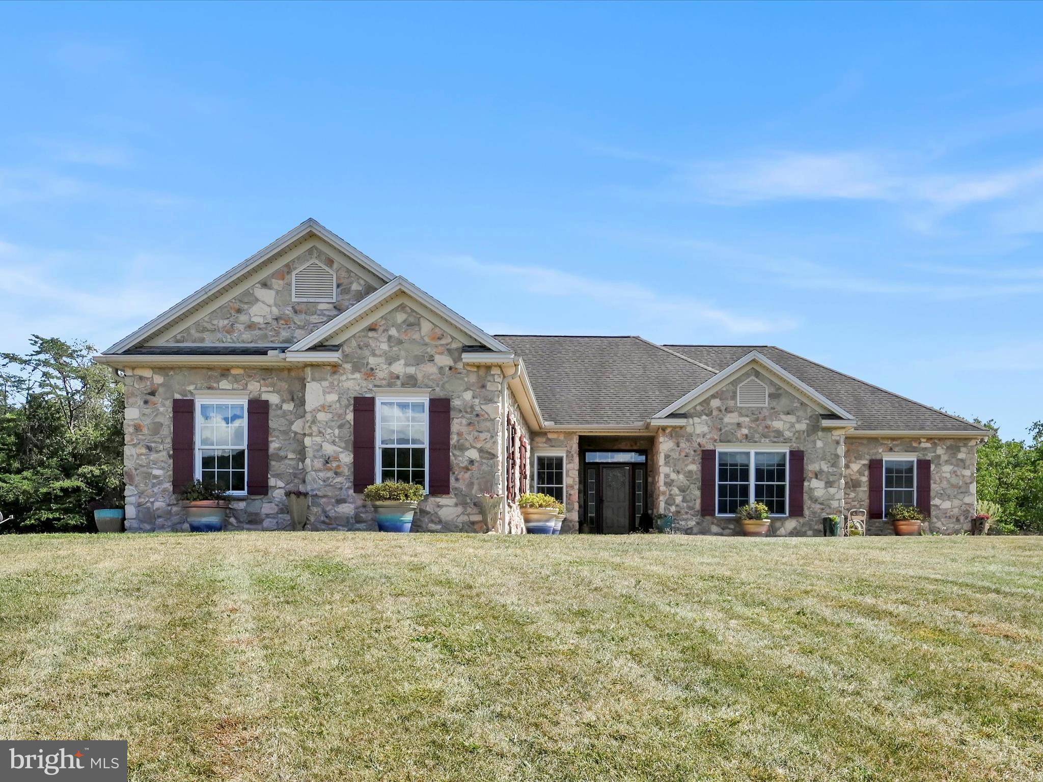 Welcome to paradise!
Pass through the electronic gated entrance and follow the winding paved driveway, beautifully lined with light posts, to this custom-built ranch home on 8 private acres. The property is fully fenced, offering peace, privacy, and security.
Inside, you’ll love the open floor plan, highlighted by a stunning stone gas fireplace. The chef’s kitchen comes fully equipped with appliances, recessed lighting, and a spacious pantry. The primary suite is truly a retreat, featuring a walk-in closet, custom tile shower, jacuzzi tub, and breathtaking views of the mountains and pool. Two additional bedrooms share a convenient Jack & Jill bathroom, while a 3-season sunroom floods the home with natural light and panoramic views.
Additional interior features include an Omni interactive system, built-in speakers throughout, a sunroom spanning the back of the home overlooking the pool, and a whole-house generator for peace of mind. The attached garage provides protection for your vehicles.
Step outside to your backyard oasis, complete with a heated in-ground pool with diving board, pool shed (with all supplies and equipment), a fenced-in pet area, and an oversized Trex patio with fire pit for entertaining.
But that’s not all—car enthusiasts and hobbyists will fall in love with the detached garage offering over 2,800 sq. ft. of space, propane heat, air conditioning, its own generator, office, bar/movie room, full bathroom, and loft-style living quarters. It easily stores 9+ cars, an RV, or equipment, with additional carport parking.
Located just minutes from Swatara State Park, the Appalachian Trail, horseback riding, hiking, biking, and with quick access to I-81, this property combines luxury, privacy, and convenience.
🌟 This one-of-a-kind estate will not disappoint—make it yours today before it’s gone! 🌟