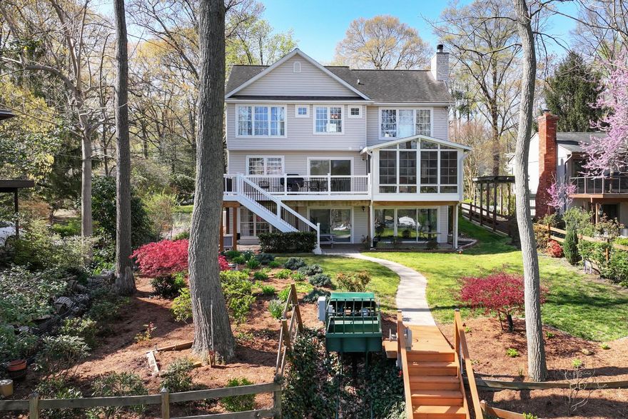 Perched on the Severn River, 928 Waterview Drive is a well-maintained waterfront home in the desirable community of Arden on the Severn. Set on a one-third acre lot with a level waterside yard and a convenient tram to the private, multi-slip deepwater pier, this residence invites you to embrace the very best of coastal living. So many boating options, with water depth that can accommodate a sailboat.
The home offers over 3,000 square feet of thoughtfully designed living space across three stories. The main level’s open floor plan offers an easy flow between rooms and lots of natural light, while the fireplace in the family room adds a coziness to the space. The spacious kitchen overlooks the waterside deck and opens into the formal dining room. There is casual dining at the breakfast bar, and there's also space for a kitchen table facing the water. The adjoining family room has water views and provides access to the lovely three-season room. Hardwood floors are found in the dining room and family room.
Upstairs, a generous primary suite impresses with cathedral ceiling and ample closet space. The ensuite primary bathroom offers dual sinks, walk-in shower and soaking tub. Two additional bedrooms upstairs are generously sized and share a bathroom. The fully finished, walk-out lower level adds exceptional versatility, complete with a recreation room, an additional bedroom, and a full bath — wonderful for guests or multigenerational living. Step out to a shaded, waterside patio from the rec room. An attached two-car garage and ample deck and patio spaces complete this wonderful property.
Arden on the Severn is a beloved waterfront community, where residents enjoy beaches, boat ramps, a dinghy dock, a covered pavilion, picnic areas, and playgrounds.