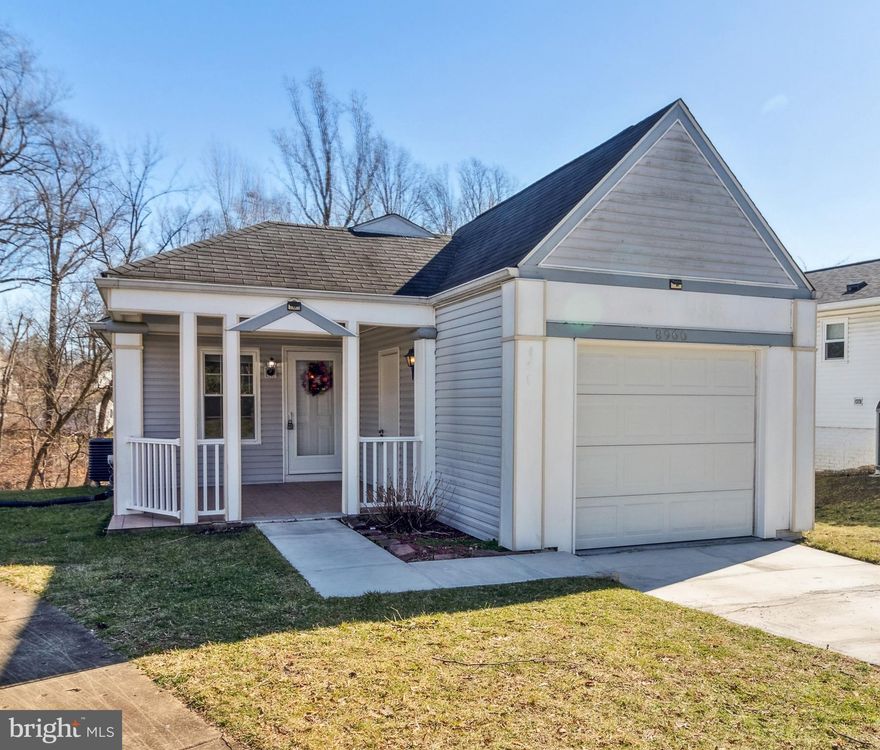 **Offers due Monday 2/26 at 1pm** Charming 3-bed, 3-bath single family home with over 2,000 sq ft, 1-car garage and backing to wooded area. Enter to a bright and airy main living area, featuring a vaulted ceiling, skylights and open layout. The spacious Chef's kitchen boasts white cabinets, granite countertops, stainless steel appliances, and adjacent dining area with access to the sunny outdoor deck. Retreat to the main level owner's suite, showcasing real maple hardwood floors, walk-in closet, and a spa-like en-suite bath with tiled stand-up shower, providing the perfect single-level living experience. Two additional bedrooms and a full guest bath with a tub and bluetooth speakers complete the main level. The lower level is ideally-situated for entertaining long-term guests, in-laws, or hosting a movie night in the large rec room offering walk-out access to the rear yard. Fully-equipped with a wet bar, laundry room, full bath, and den/office, this versatile lower level space can be easily adapted to your needs. Step out through the slider door to the rear patio, offering ample yard space that opens to a wooded lot and stream. Enjoy a morning coffee on the large front porch or relax on the peaceful side deck with tree-lined views. The attached garage with epoxy flooring and driveway provides off-street parking for 2 cars, plus plenty of street parking available for visitors. Recent updates include new paint (2024), dishwasher (2023), microwave (2024), garbage disposal (2023), water heater (2017) and HVAC ( 2019). Just minutes to Harris Teeter, Starbucks, Guilford Park sports courts and tot lot, Savage Mill, Maple Lawn, and downtown Columbia. A commuter's dream location with easy access to 95, 32, multiple Amtrak train stations, and only minutes to Ft Meade, NSA, Baltimore, Annapolis or DC.  Don’t miss this rare find!
