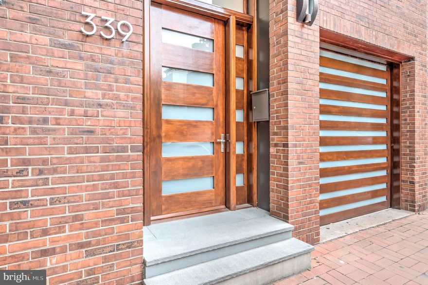 Welcome to 339 S 5th Street - an ultra modern estate centrally located in the heart of Center City Philadelphia! Society Hill is one of the city's most critically acclaimed neighborhoods that offers its residents the perks of location, convenience, and above all access to historical Philadelphia within arms reach. Enter in this multi-level, extra wide residence and immediately take notice of all of the pristine updates and finishes throughout. The custom made mahogany front door welcomes you and acts as your entry way into lustrous Brazilian walnut floors seen throughout the home. Fix your attention to the adorning floating staircase serving as the first modern attraction that leads you up and down to the rest of the luxury that awaits. Explore the immediate lower level family room to find recessed lighting, custom built shelving, a powder room, and a finished utility room for laundry and storage. Venture upstairs to the main living quarters - a space that presents an open floor plan for easy customization and access to from the living room and nearby gourmet kitchen. Amenities including but not limited to floor to ceiling windows with custom treatments, additional recessed lighting, and a gas fireplace appointed upon a stone accented wall. The gourmet kitchen and dining area features a designated space to eat and entertain, Wolf & Sub-Zero high-end stainless steel appliances, handpicked cabinetry, quartz countertops and a beautiful matching backsplash to bring it all together. Continue upstairs to the second floor - home to the grand master suite. Enter into a formal sitting area with nearby additional fireplace and mantle, incredible views, and a glass sliding door leading to a private balcony. The walk-in closet offers a huge space for the showcasing of his and hers belongings. Continue through the suite and find additional closet storage including another washer and dryer set. Nearby is the ultra modern master bathroom: a true spa experience offering a standalone soaking tub, stunning glass encased shower stall, an impressive floating vanity with his and hers soaking bowls, and pristine tiling wall to wall. Continue to explore upstairs and come across three personal sized bedrooms with the same luxury finishes you would expect to see. The hall bathroom is a miniature master bathroom offering an additional standalone tub, a glass doored shower stall, and gorgeous tiling throughout. Take the tour outdoors to your very own private, brick enclosed rear back yard with deck. Allow this space to become the center of attention for your closest friends and family. If this home isn't enough to entice you, don't forget that you are within minutes of everything Philadelphia has to offer you - high end dining and shopping, tourist attractions and historical figures, numerous parks and exercise trails, as well as access to and from all of the city's major highways and roads.