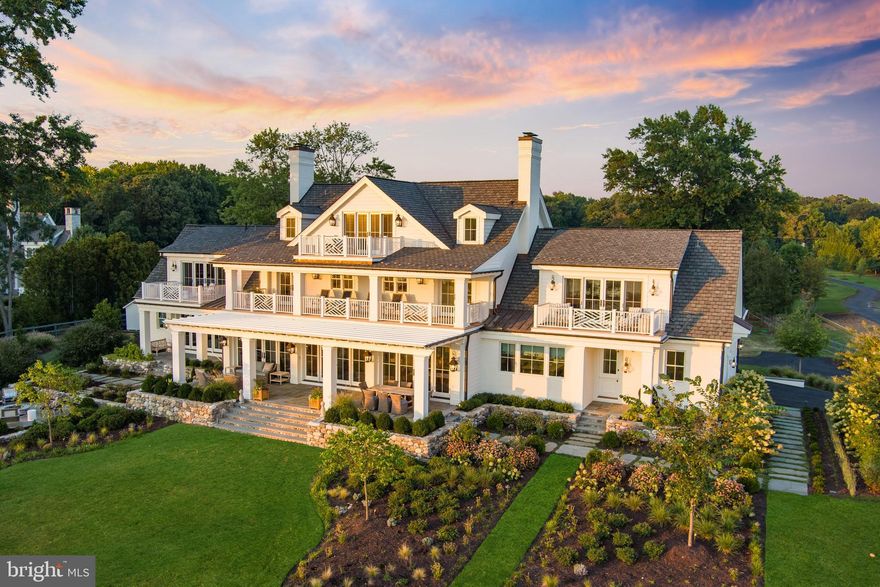 This Georgian-style estate marries the very essence of quintessential Chesapeake living with the gracious allure of Southern charm. Ideally sited on 6.12 picturesque waterfront acres along the serene shores of Duvall Creek, this home offers an unparalleled blend of luxurious living and architectural excellence. This custom-designed masterpiece underwent a complete renovation down to the studs in 2019–2020 and is the result of a collaboration between Gate One Builders and Purple Cherry Architects/Interior Design.  The home boasts a wealth of exquisite features, from its designer fits and finishes to endless examples of fine craftsmanship.  Custom millwork throughout includes coffered ceilings, custom moldings, lovely ceiling  treatments, wide plank oak floors, and numerous arched doorways. The home was meticulously designed to highlight its exceptional waterfront location, with generously proportioned living spaces that artfully lead your eye to the breathtaking water views.  Main level highlights include an open floor plan living room with gas fireplace and adjacent dining room with multiple sets of French doors that open to the waterfront terrace, creating a seamless blend of indoor and outdoor living.  The gourmet kitchen and butler’s pantry are a chef's dream, with Vermont Imperial Danby marble countertops, custom alder wood island, and custom cabinetry with curated storage and display features.  The family room has custom cabinetry with window seats, bookshelves, storage, and an expansive bar, which opens to a covered bluestone terrace, provides the perfect setting for relaxation, and the dramatic and refined library is a true show stopper.  An elevator adds convenience and accessibility to all four levels of this magnificent home.  As you ascend to the second floor, you'll discover three spacious bedrooms including the primary suite.  Each bedroom is South facing, with an ensuite bathroom and waterfront balcony.  The third floor presents two more bedrooms, both facing South and also featuring ensuite bathrooms. The fifth bedroom on this level is ideally suited as an upper-level office, complete with a private IPE balcony overlooking Duvall Creek and the South River. The lower level basement is a haven of wellness and relaxation, featuring a gym with a sauna for unwinding after a long day. A full bathroom, bonus room, dog washing area, and walk-up stairs to the backyard offer added versatility and convenience.  The exterior of this estate is equally as impressive, featuring a fully-fenced yard, stately, secured circular drive, elegant entry and portico, two-car garage,  tastefully designed hardscaping, and meticulously selected landscaping with irrigation for year-round beauty. Numerous waterfront IPE balconies each offer a haven of tranquility.  The backyard is a true oasis, with a grand terrace facing the water, integrated fire pit area, and an expansive flat yard with 233’ of water frontage, perfect for outdoor activities and gatherings.  A 250’ dock with 30,000-pound lift and a 7' mean low-water depth combined with location is a boater's dream, providing easy access to Annapolis and the Chesapeake Bay.  With its custom finishes, spectacular water views, and meticulous attention to detail, this stunning estate offers a rare opportunity to experience waterfront living at its finest.