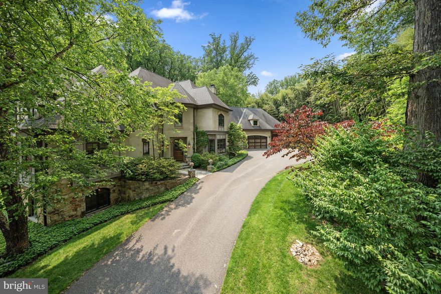 Nestled on a premier cul-de-sac in the exclusive Burning Tree neighborhood, 10 Burning Tree Court is a masterfully crafted residence sited on 1.38 private, landscaped acres. With a stunning pool, sport court, multiple patios, and expansive green space, this extraordinary home offers a rare combination of timeless elegance and modern luxury.
Designed for both grand-scale entertaining and intimate gatherings, the home features a thoughtfully curated floor plan and over 10,400 square feet of refined living space across three levels. Rich walnut hardwood floors, a dramatic two-story foyer, and elegant architectural details, including arched entryways, designer lighting, and custom moldings set the tone for the home's classic aesthetic.
A standout feature is the two-story library, adorned with rich wood paneling, built-in bookcases, custom windows, and cozy window seats, an inspiring space for work or relaxation. The formal dining room impresses with its scale, comfortably seating up to 20 guests and offering three sets of French doors that open to a balcony overlooking the lush, private backyard.
The gourmet kitchen is equally exceptional, featuring a large breakfast area, butler’s pantry, walk-in pantry, and a small office nook. The adjacent StruXture patio enhances indoor-outdoor living with a built-in grill and adjacent fireplace. The great room features a striking marble fireplace, custom built-ins with TV niche, and exquisite ceiling molding. Additional main level highlights include a grand living room, ideal for a piano, or formal entertaining, two powder rooms, a mudroom, and an oversized three-car garage.
Upstairs, the primary suite is a serene retreat, complete with a tray ceiling, a large, organized walk-in closet, a private study, and French doors leading to a balcony overlooking the backyard. The spa-inspired primary bath offers dual vanities, a whirlpool tub, separate walk-in shower, and private water closet. The upper level also includes three additional bedrooms each with ensuite bathrooms, and an additional family room.
The fully finished walkout lower level offers a spacious recreation room, family/media room, sixth bedroom, two full bathrooms, a dedicated exercise room, and a laundry room.
The 1.38-acre lot is truly an outdoor oasis, complete with a heated pool, multiple patios, one with a stone fireplace and StruXture covered patio, an outdoor shower, sport court, and generous green space for recreation and entertainment. Ample parking space includes a three-car garage and a driveway that accommodates 8+ additional vehicles.
With 6 bedrooms, 6 full baths, and 2 half baths, this exceptional home represents the finest in luxury living in one of the area's most sought-after communities.