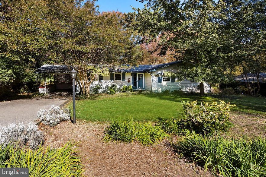 Walk into this charming Rancher and you are immediately drawn to the large picture window in the family room and luscious greenery of the backyard. The angled fireplaces, hardwood floors, and built-in bookcases at the stairs all add to the character of the home. Whether you enjoy spending your time indoors or out, there are plenty of places to relax.  The expansive deck overlooking the backyard, the screened-in porch off the dining room, or by one of the cozy fireplaces upstairs or down. Just minutes from both Annapolis and Rt 50 and situated in Annapolis Roads, this house is the ideal location for downtown dinners or your workday commute. Don't forget to enjoy the community beach or put in your kayak or paddle board for some weekend fun!  Home is meticulously cared for and ready for your vision.  Priced aggressively for quick sale.