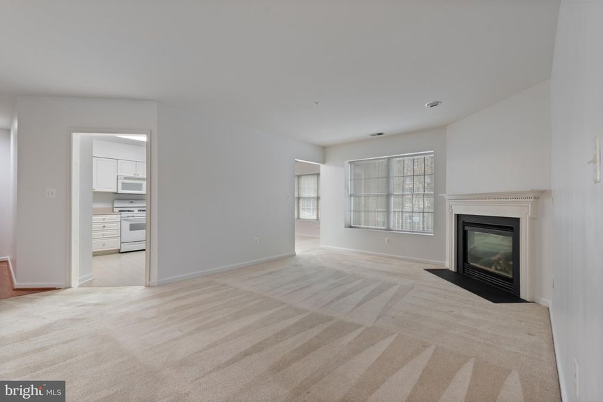 Welcome to 641 Straffan Dr - a Gem in Mays Chapel North!  Nestled in One of the Most Sought-After Gated Communities, This 2BR 2BA Condo Offers a Bright and Spacious Layout with Brand New Carpet Just Installed Throughout.  The Kitchen, with a Breakfast Bar, Opens to a Versatile Dining Area That Could Double as an Office or Family Room.  Relax by the Cozy Gas Fireplace in the Large Living Room, or Step Out Onto Your Private Balcony for Fresh Air.  You Could Have a a More Formal Dining Area Leading Right into the Living Room.  The Primary Suite Features a Large Walk-In Closet and En-Suite Bathroom.  An Ample Second Bedroom, Full Bath, and Large Laundry Room with Washer/Dryer and Extra Storage Complete the Space.  The Building Offers a Secure Entrance, Elevator, and Plenty of Parking.  Plus, Enjoy Convenient Access to Mays Chapel Swim Club, Graul's Market, Local Dining, and Shopping Just Across the Street!