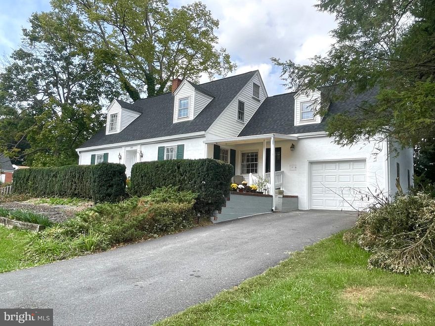 What an opportunity to own this exquisite 1948 Cape Cod on the highly sought after West End of King Street in Martinsburg.  This beauty is situated on a .44 acre corner lot. She has 3 year old roof, gutters with leaf guards, and recently had a complete exterior facelift.  This home is full of unique, quirky features you will only find in a Vintage home.  The kitchen has original built in cabinets, 36 in range, the original cast iron sink with drainboards, and brand new white quartz countertops.  Your mail is delivered into the home's built in mailbox. The main level and upper level hallways have metal doors for the laundry chute, and the built in cabinet in the basement laundry area, catches it! The stairway has an original metal and wood chair lift which is operated by a motorized winch in the basement.  Very cool. If you have no mobility issues, just use it for your laundry basket or vacuum cleaner! This home has lots of small and large storage areas within the entire home, with clothing closets lined with cedar.  This home is complete with  a dual zoned heat and air conditioning. Also still installed is the hot water baseboard boiler, which could be updated and returned to function as a back up heat.  All rooms are large, full of light, and freshly painted. The living room opens to a large screened porch. The living room also has a spiral staircase that leads down to the finished recreational room.   No remarks in this listing can describe how wonderful this home is.  Make your appointment to see it for yourself and start making your own memories in a home of yesteryear! It won't disappoint!