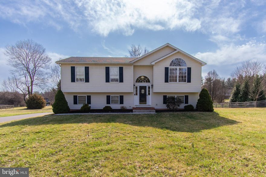 THIS IS THE ONE! Maintained to perfection inside & out and tucked away on a quiet non-thru street on a beautiful .83 acre lot. Featuring bright and open main living areas with soaring vaulted ceilings. The large kitchen has a center island and updated SS appliances (new in Nov 2023) and flows right into the dining area and on into the living room. 3 BDRM & 2 BA including a primary suite round out this level. Don't miss the gorgeous LVP floors that flow throughout (just installed in 2021). The finished walk-out lower level boasts a HUGE family room + a 1/2 bath and laundry room (W/D stay!). Large rear deck is the perfect spot to relax and entertain and has stairs down to the driveway & backyard. You will LOVE the lot-flat and open with all the space you've been looking for! Entire house was just freshly painted before listing! HWH is BRAND NEW (March 2025), driveway was  redone in 2023 & just sealed in 2024, new Trane HVAC in Aug 2019, Roof (Aug 2016), deck updated in 2023 & SO much more...this home is truly move in ready! Just minutes to the Potomac River, C&O Canal, schools, shopping, dining & interstates.