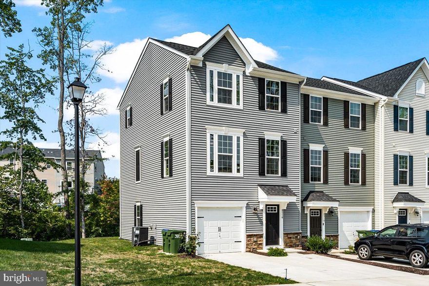 End unit townhome, just two years young, in the Villages at Courthouse Commons.  Are you ready to enjoy 3 levels and nearly 2400 est. sq feet of living?  JUST LIKE NEW...why wait for a home to be built when you can enjoy your home NOW before the holidays?  This 3 bed two full and two half bath home is sure to check all of your boxes.  The entry level is equipped with a powder room plus  a 15 X18 space that's  currently used as a workout haven for the sellers, however would make a great office or additional living space.   On the main level you will find a great sized kitchen with pantry, dining area AND a light filled family room, plus a powder room, great for guests.  On the upper level all 3 bedrooms, a shared bath &  laundry can be found.  The primary bedroom has a tray ceiling and walk in closet.  The primary bathroom  has a standalone shower & double sinks.  Not only do you have your own driveway but parking is plentiful in this part of the community, come check it out and call it home.  Schedule your tour now!