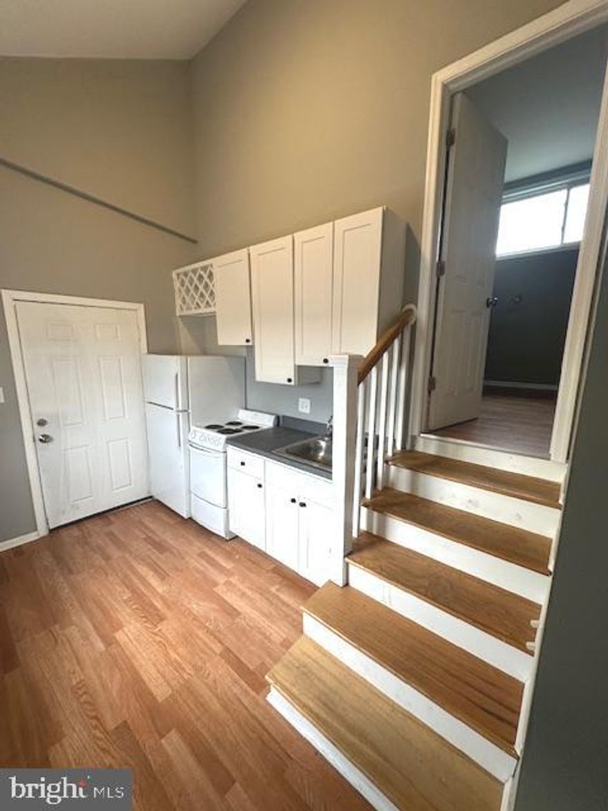 ALL UTILITIES AND CABLE INCLUDED - Updated 2 bedroom / 1 bath apartment available for immediate occupancy. Unit has a full spacious kitchen, new engineered wood floors throughout, and central air conditioning. Includes all utilities and cable. Coin laundry on site. Convenient location in Rosedale - close to major roadways. On-site Property Manager and Security cameras on site. Off street parking included. This property is a 21 unit property with 16 residential apartments, 3 commercial garage bays, and 2 detached houses.  This unit is one of the 16 residential apartments.  Sorry, no pets