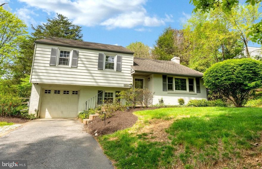 Calling for highest-and-best offers by Sunday, May 2, at 10pm. Charming split level home with incredible yard in the heart of TE school district! This lovely home, minutes from downtown Wayne, Devon Yards and La Cabra Brewing, is a move in ready oasis,  perfect for your summer enjoyment. The mature landscaping greets you as you walk up the stone steps to the front door. A charming entry foyer with coat closet leads to the open-concept main living space. This extra-long room has plenty of room for a dining area, living/sitting area around the wood-stove fireplace, and a separate area for a home office or play area! The living and dining areas have been outfitted with custom plantation shutters. The kitchen with updated cabinetry and granite counters is open to the dining area, perfect for entertaining! The dining area also features sliders to the incredible deck and yard. Downstairs, an updated den with new flooring is perfect for an office, playroom, or getaway spot. This den room leads to the refreshed laundry room/mudroom and half bath. Another exterior door from the laundry is the perfect side entry for unloading swimwear and bath access for swimming guests! The garage has inside access to this mudroom as well. Upstairs you’ll find the master bedroom with expanded, custom closet. Next door is the neutral and refreshed hall bathroom with its own linen closet for extra storage. Two other bedrooms complete this floor, one with a charming alcove perfect for a window seat! A walk-up, two-level attic is accessed from the bedroom floor and presents plenty of storage! Many neighbors have converted the first attic level to a master suite or 4th bedroom. The backyard sets this house apart. An incredible, mature, tree shades the back Trex deck and houses outdoor lighting for a fairytale dining area. Extensive landscaping and steps lead to the beautiful and large pool. This pool is ready for summer entertaining, kid playing, and weeknight relaxing! It's perfectly placed to still allow lots of space for gardening, yard playing and room for a dog to run. A very private and relaxing oasis! TE Schools, move in ready, private and lush backyard oasis – could this be your new home?