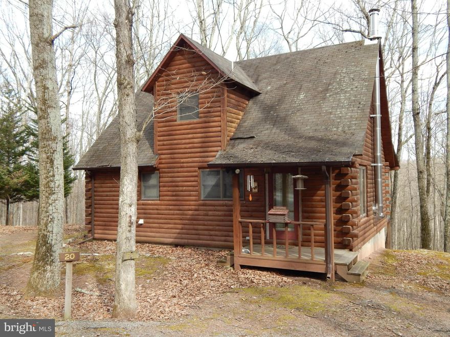 CUSTOM BUILT LOG CABIN  2BR, 2BA Chalet in Coolfont features wood floors, wood stove, Laundry rm, main level BR & spacious screened deck.  Upper level features a MBR suite.  Community amenities include in-ground pool, 3 tennis cts, volley ball ct, hiking trails & playground surrounded by a level lawn, making this the perfect getaway location.W/in 5 M of Berkeley Springs &  7 M to Cacapon State Pk