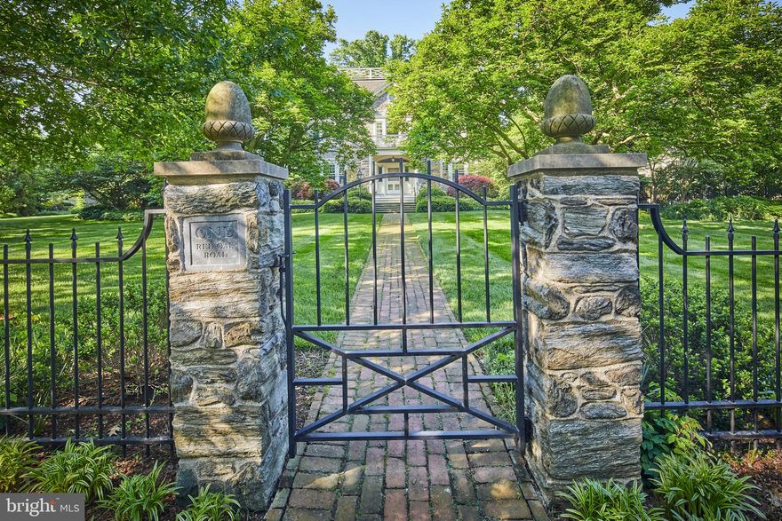 When Governor Charles Miller built One Red Oak Road, he created one of Delaware's landmark residences. Completed in 1905, Governor Miller's home is now a stunning private estate gracing its own city block, with fully enclosed grounds of just over one acre. The current owner purchased the property in 2000 and immediately began a three-year renovation that both restored the home's original beauty and modernized it to accommodate a contemporary lifestyle. The complete renovation comprised, in part, Ludowici tile roof; electrical service; eight-zoned HVAC; major plumbing upgrades; full house Creston sound system and an award-winning two-story addition with full basement. The main floor's large, classic rooms flow easily into one another and feature exquisite woodwork and crown moldings, all of which were restored by hand. Large double-entry foyer opens to a welcoming reception room on the left with a unique stepped-in design marble fireplace. To the right of the foyer, the music room and living room, with another large marble fireplace, are open to one another. Elegant, formal dining room accommodates a variety of seating arrangements and includes a large, curved window seat under the bay window. The well-appointed butler's pantry connects the kitchen to the dining room and features the original radiator plate warmer, a wine refrigerator, ice machine and drawers lined specifically for silver storage. The thoughtfully designed gourmet kitchen has custom-height granite counters and ample storage. The distinctive selection of appliances includes: a Thermador six-burner cooktop with downdraft and additional ventilation in the ceiling, two wall ovens, two warming drawers, a Sub-Zero refrigerator with two freezer drawers, built-in Sharp microwave, two Miele dishwashers and a kick-plate floor vacuum. The kitchen opens to the step-down family room with a painting above the fireplace that lifts at the touch of a button to reveal the television. A generous mudroom with built-in cabinetry for storage, radiant heat flooring and an informal powder room leads from the kitchen to the mature gardens and additional off-street parking for two cars. A gracious, curving staircase rises from the main entry foyer to the second floor. Large master suite with built-ins and unique Jefferson door offers views of both Rockford Park and Olmsted-designed parkway. French doors connect the master bedroom to a large dressing room with plenty of natural light and another pair of French doors that open to the suite's second private balcony overlooking the pool and gardens. A sumptuous bath boasts radiant heat flooring, an over-sized steam shower, and large Jacuzzi tub. Three more large bedroom suites are located along separate hallways. A well-planned laundry room with a Jacuzzi sink for delicates and sweater dryer racks behind louvered doors with a dedicated extraction fan complete the second floor. The third floor features a large project room with numerous built-ins, bedroom with full bath and morning kitchen, a secondary study with abundant custom storage, and a private guest suite with sitting room and full bath. All levels of the home are accessible by the elevator. The lower level yields unexpected surprises for a home of this vintage. The gym, with reinforced floor and walls, has a dedicated ventilation extractor. A sauna and a full bath are located off the recreation room. A separate hallway leads to a 3000 bottle wine cellar with antique stone flooring, rough hewn plaster, and separate temperature control with remote monitoring. Seasonal living space outside includes a large, covered porch overlooking a generous heated plaster pool and slate patio. Pool house has a nicely equipped kitchen, changing area, and full bathroom. Extended family, visitors or staff will be comfortable in the apartment located above the pool house and two-car garage.