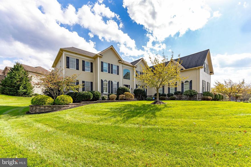 The Belle of the Ball in Byers Station / Downingtown East Schools: Nestled on a premium, level lot that backs onto serene open space, this upgraded and expanded executive home offers nearly 6,000 square feet of luxurious living. As you enter the grand foyer, you are greeted by soaring twenty-foot ceilings and a stunning curved staircase. Hardwood floors flow throughout most of the main level, where the formal dining room and living room elegantly flank the foyer. The home's unique bumped-out design enhances the two-story family room, breakfast room, and kitchen, creating a spacious and inviting atmosphere. The upgraded kitchen features a butler sink in the extended island, granite countertops, a wall oven, and a walk-in pantry, with easy access to the rear staircase from the adjoining breakfast room. In addition to these impressive spaces, the main floor includes a generous 13x29 bonus room, a study, and a separate laundry room. The luxurious master suite boasts a sitting room, four walk-in closets, and a spacious bath. Each of the four bedrooms is accompanied by its own full bath, while the expanded bonus room has created two additional bedroom suites, each with its own sitting room, walk-in closet, and full bath. Step outside to the custom paver patio, perfect for outdoor entertaining. This vibrant community offers a wealth of amenities, including two clubhouses, two swimming pools, tennis and basketball courts, as well as several walking trails and playgrounds.