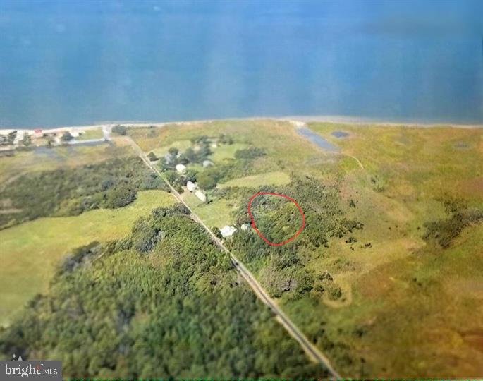 Welcome to your slice of paradise! This one-acre lot on Deal Island offers a unique blend of natural beauty, tranquility, and captivating water views. Whether you’re dreaming of building your forever home or a serene vacation retreat, this property is a canvas waiting for your vision. Elevated Possibilities: build a home on stilts and you'll have expansive water views. Imagine a cozy living area on the first floor, where you can step out onto a covered deck and feel the breeze. Or go even higher—a spacious second floor with expansive windows framing the ever-changing waterscape.