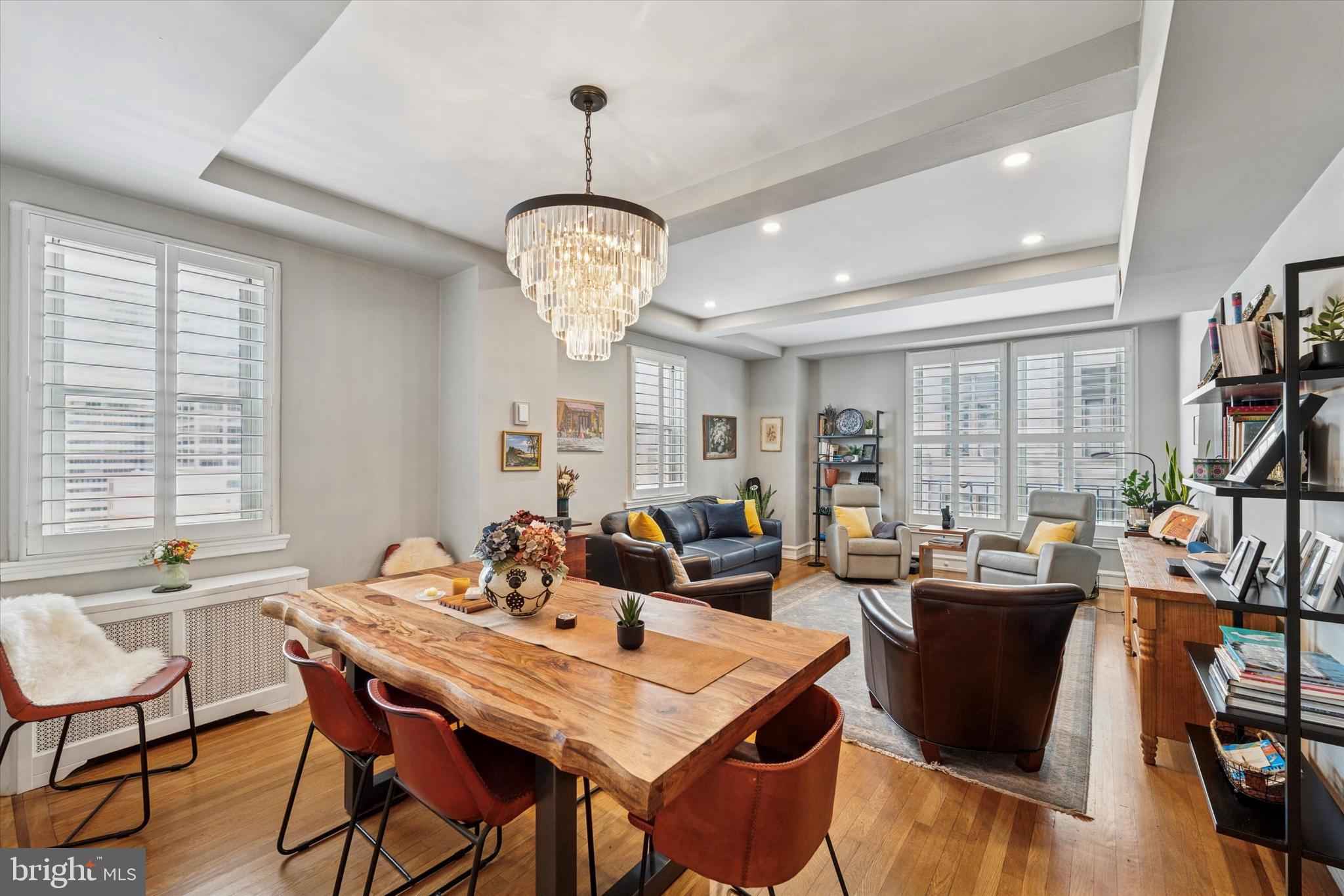 Don’t miss this rare opportunity to own a beautifully renovated 1-bedroom, 1-bathroom corner residence in The Rittenhouse Plaza, one of Philadelphia’s most iconic pre-war buildings located directly on Rittenhouse Square. Residence 14F combines classic architectural charm with thoughtfully modernized interiors—offering a refined and comfortable lifestyle in the heart of the city.
This light-filled, high-floor home features a well-designed layout with exceptional character and detail. The entry gallery leads into a sophisticated living space adorned with oak hardwood floors inlaid with walnut borders, coffered ceilings, detailed crown and baseboard moldings, and plantation shutters on every window. The gracious living and dining rooms are flooded with natural light and offer a seamless flow for relaxing or entertaining.
The chef’s kitchen has been tastefully updated with Calacatta marble countertops, a gray tile floor, mosaic tile backsplash, and wood cabinetry with elegant brass drawer pulls. High-end appliances include a Bosch 5-burner range, microwave/convection oven, dishwasher, refrigerator, and a Marvel wine cooler—perfect for the home chef or entertainer. The formal dining room features a sparkling crystal chandelier and easily accommodates seating for six or more, opening directly to the living area to create an ideal gathering space.
The primary bedroom is generously sized, offering a tranquil retreat with a custom-built closet and an additional walk-in closet, providing excellent storage. The adjacent marble bathroom is a true standout, with an oversized wood vanity, double sinks, and a large glass-enclosed soothing aroma therapy steam shower with a built-in bench—offering both functionality and spa-like comfort.
Additional features include a separate laundry room with a full-size washer/dryer and sink and a dedicated private storage unit included with the home. Residents of The Rittenhouse Plaza enjoy access to The Laurel Condominium’s state-of-the-art fitness center at 1909 Walnut Street for just $50 per month, as well as seasonal access to their beautiful outdoor pool for $350.
The Rittenhouse Plaza is a full-service, doorman cooperative known for its grand architecture, quiet elegance, and unmatched location. This pet-friendly building offers 24-hour concierge and doorman service, secure entry, and beautifully maintained common areas. With oversized layouts, high ceilings, and solid construction, units here offer the kind of quality and privacy rarely found in newer developments.
Located directly on the northwest corner of Rittenhouse Square, the building offers front-row access to one of the most vibrant, walkable, and prestigious urban environments in the country. According to Places Rated Almanac, Rittenhouse Square is ranked the 6th best neighborhood in North America. Residents enjoy proximity to some of the best restaurants and many retailers within a 3-block radius, including premier shopping along Walnut Street, world-class dining, and charming cafés. The building is also a short walk to the Avenue of the Arts, University City, and major hospitals and universities such as Penn, Drexel, and Jefferson. Amtrak’s 30th Street Station, Suburban Station, and Philadelphia International Airport are easily accessible, making this a perfect city home for both local professionals and bi-coastal commuters.
With timeless architecture, luxurious interior finishes, and a location that offers the best of Philadelphia’s cultural and culinary scene, Residence 14F at The Rittenhouse Plaza is a rare offering not to be missed.