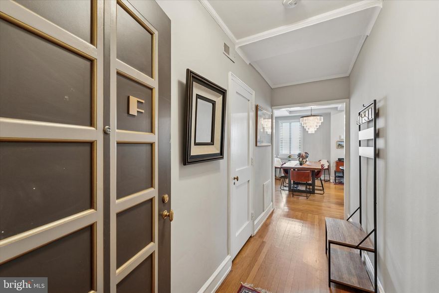 There's a reason New Yorkers feel at home here. The Rittenhouse Plaza is Philadelphia's answer to a classic pre-war co-op—timeless bones, white-glove service, and a standard of shared ownership that other buildings simply don't offer. Residence 14F is one of its most compelling: a beautifully renovated corner one-bedroom that brings genuine warmth and light to a building where many units remain untouched.
A welcoming foyer sets a gracious tone before opening into generous living and dining space filled with natural light. The separate kitchen is finished in Calacatta marble with Bosch appliances, brass accents, and a Marvel wine cooler. The marble bath features a double vanity and aromatherapy steam shower. Oak floors with walnut inlay, coffered ceilings, and plantation shutters throughout—this is a home that was done right.
Step outside and you're on one of Philadelphia's most beloved squares—a true neighborhood in the best sense of the word. The park itself draws residents daily, and throughout the year it hosts the Rittenhouse Square Fine Art Show, the Fine Craft Show, and a beloved weekly Farmer's Market brimming with local produce and artisan goods. Surrounding the Square, Rittenhouse Row is widely regarded as Philadelphia's premier shopping and dining corridor. Walnut and Chestnut Streets offer an exceptional mix: celebrated local institutions like Joan Shepp and Boyds alongside national names like rag & bone, Anthropologie, Free People, Uniqlo, and Vince. Dining runs the full range—from neighborhood staples to some of the city's most acclaimed tables—all within an easy stroll.
Co-op ownership sets this building apart in ways that matter. Your monthly fee covers property taxes, heat, gas, internet, water, sewer, snow removal, and common area maintenance—plus 24-hour doorman and concierge service. Residents also enjoy access to The Laurel's outdoor pool and fitness center. Unlike a condo, every buyer is vetted by the board to confirm they can carry their share of costs, ensuring a community where owners are held to the same standard. Financing options exist, though many buyers choose to purchase with cash.
Turnkey, vetted, and move-in ready. A true piece of Philadelphia's pre-war legacy—where elegance meets ease and every detail feels intentional.