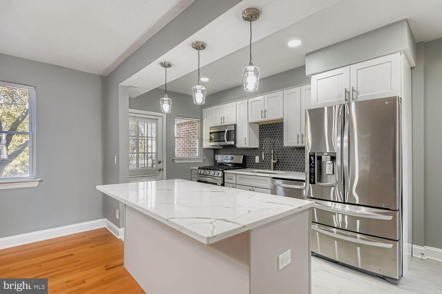 Beautifully remodeled 3-level townhouse featuring a main level with an open-concept kitchen, dining, and living area, complete with brand-NEW appliances, sleek white cabinets, NEW quartz countertops, and tile flooring. The upper level offers 3 spacious bedrooms and 1 fully updated bathrooms with elegant fixtures and new ceramic tile. The finished basement includes 1 room, 1 full bath, and extra space. With NEW flooring throughout, modern lighting, and stylish finishes, this move-in-ready home combines comfort and sophistication in a convenient location.