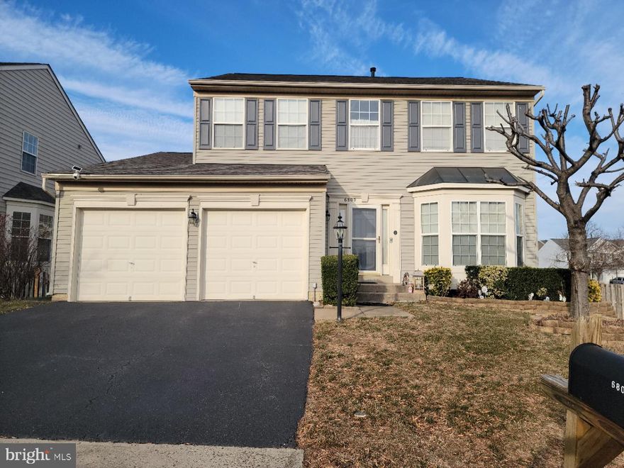 This renovated Tyler from Richmond American sits on a corner lot. The kitchen was totally redone in 2024 with quartz counter tops, Bosch microwave and dishwasher 2023, soft close cabinets. Crown molding and chair rail in formal LR/DR. Enjoy entertaining on your two-tier deck overlooking all fenced in yard. The electric Sunsetter awning extend your living area, protecting you from the sun and rain. Inside, you'll find hardwood throughout main level (2023), HV/AC 2025, water heater 2023 with 10-year warranty, roof 2019, sump pump 2025. You'll find 4 generous bedrooms and 2 full baths on the second floor. The primary bath has been renovated in 2023 and offers a freestanding tub, separate shower, and double vanity. The walkout basement is perfect with a large 5th bedroom, full bath and a recreation room.