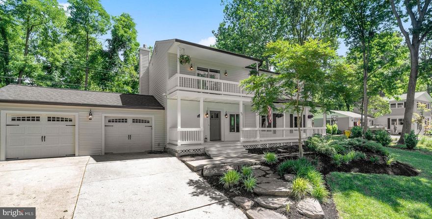 You will not want to miss this fabulous colonial in water privileged Berrywood! Welcome to this turn-key 5 bedroom, 4 full bathroom, 2 car garage home with numerous updates.  Gorgeous curb appeal with a freshly remodeled exterior.  New siding, roofing, gutters & shutters. Double decks overlook your manicured lawn and the mature trees and greenery upkept by the community. Enjoy an open concept main level featuring an updated & modern kitchen complete with center island & bar seating, stainless appliances, new granite countertops & built in desk nook.  Kitchen is open to the dining area with NEW gas fireplace  and offers slider access to the incredibly private rear yard.  Large main level family room is  open to kitchen and new, custom built mud room area.  Stunning New England wide plank wood flooring throughout main and upper levels is the ultimate show stopper coupled with fresh neutral paint and updated lighting both inside & out. A full bathroom on the main level makes dinner & bath time a breeze.  Bedroom level is spacious with 4 generously sized bedrooms, 2 additional bathrooms and a bonus sitting area with a slider to your perfect upper front deck.  Primary suite offers an amazingly renovated private bathroom with barn door and walk in closet as well as a private rear balcony overlooking the back yard.  Step outside of the primary suite into the cozy sitting area with built in bookcases and upper front deck beyond.  Lower level offers a 5th bedroom guest suite with access to back yard and an additional full bathroom, also updated.  A great rec room along with dedicated home gym area as well as ample storage rooms/closets complete the lower level.  Save money on your heating & cooling bills with 3-zone geothermal heating & cooling.  Entertain with friends or enjoy a quiet evening in your tranquil backyard backing to a protected wildlife area that fully surrounds the property, creating the utmost privacy.  Extensive hardscaping & covered paver patio are the perfect spot to enjoy a summer sunset.  Large storage shed for water toys plus  privacy fence with double gate for easy boat storage.  Rear yard also offers doors to your garage and mudroom spaces.   Just a few steps away is one of 2 community marinas!  Berrywood is known for it's fantastic community feel offering something for everyone. 2 marinas, boat slips, boat launch, pool, swim team, playground, tennis courts, basketball court, open fields & boat/SUP storage, not to mention an active social committee with year round events.  Blue Ribbon Severna Park Schools, easy commuter access to Baltimore, DC, Annapolis & Ft. Meade, and plenty of local attractions, restaurants and shops just a short drive away.  Don't miss this one- schedule your private tour today! Pool Bond conveys!