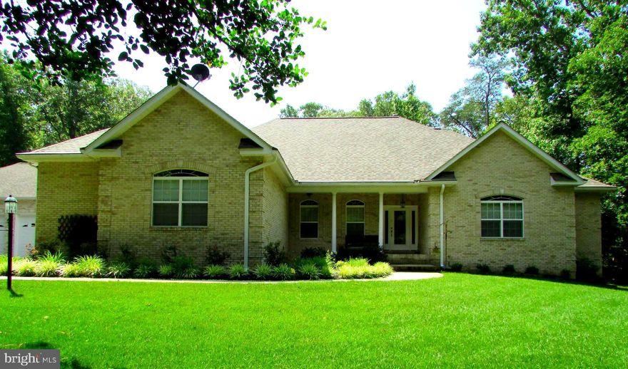 Stunning Custom Built Brick Rambler with a fully finished basement on just over 3 acres of secluded privacy.  Just minutes from Charlotte Hall and LaPlata.  Home features ALL the amenities and quality you would expect.  Home has just over 5,100 sq.ft. of beautifully finished space.  4 spacious bedrooms, 3 on the main level and 1 large master bedroom with full bath on the lower level.  2 1/2 baths on the main level. Main level master bath has a jetted tub, oversized walk-in shower, double sinks, and ceramic tile floor.  Upgraded cabinets and counter-top in the main level gourmet kitchen with a wine cooler, as well as a full, equally nicely done kitchen on the lower level. Main level kitchen also has an octoganal sunroom/breakfast nook. Most of the home has beautiful, top quality hardwood floors and ceramic tile, with carpet in some of the bedrooms.  Almost new architectural roof.  Double-sided fireplace on main level and corner fireplace in lower level master bedroom.  2 large storage sheds, and one slightly smaller lawn equipment shed.  33' x 20' stone patio with canopy system for outdoor entertaining.  Massive 50' x 16' family room on the lower level.  Double wide walkout from the lower level to the backyard.  Whole house generator.  Oversized 3 car detached garage for all you car lovers, as well as a 3 car attached garage, and lots of driveway parking space.  This home is immaculate, and has sooo many top quality features that they are too numerous to list.  I will have lots of inside pictures posted before home becomes active on the market after Estate Escape does the moving sale sometime in mid-late July.  Check Estate Escape for more details about the moving sale dates.  Sellers are offering a one-year home warranty to the Buyer(s)  This gem will not last long.  List price is based on pre-listing appraisal.