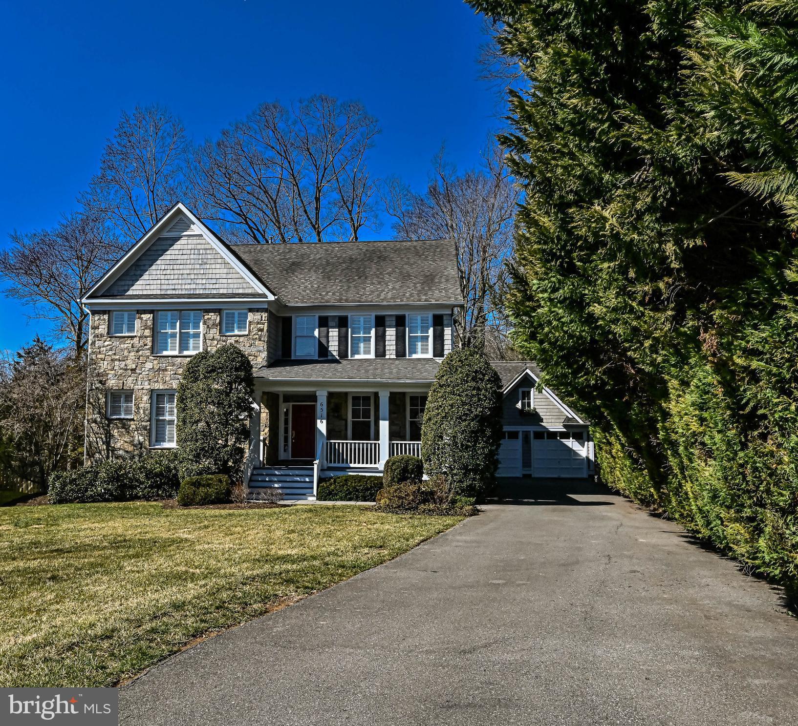 CONTRACTS DUE TUESDAY, MARCH 8th at 9A PLEASE. Sited on a quiet street in the heart of Cabin John, this beautifully designed home is just minutes to the canal, parks, bike path, Community Center and four miles to D.C. The backyard is a true oasis with a heated pool, cascading waterfall, stone patios and a large deck. The charming front porch is warm and inviting and welcomes you to the home. Once you step inside you will be impressed by the open floor plan and the generously proportioned interior. The main level features rich architectural details and is flooded with light. Off the entry is the library with built-in cabinets, bookshelves and a desk. The formal living room and well proportioned dining room are great for entertaining. The family room is adorned with a gas fireplace surrounded by built-ins, a wall of windows and French doors that lead to the deck. The kitchen is open to the family room and features two wall ovens, a gas cook top, a large island, sunny breakfast area and a communications center. There is also a mudroom off the kitchen with access to the side porch. As you venture upstairs you will reach the huge owners suite with a tray ceiling, large sitting area and a three-sided gas fireplace. The luxurious primary bath has a jetted tub, glass-enclosed steam shower, a warming rack for towels and large vanity with two sinks. The upper level has a second bedroom with an en-suite bath, two additional bedrooms that share a Jack & Jill bath and a laundry room. The lower level features a large recreation space with a granite-topped bar that houses a sink and small refrigerator. There is also a media area with a gas fireplace, fitness room, fifth bedroom and full bath. The French doors open to a covered stone patio that lead to the rear. The backyard exterior is a spectacular retreat with it’s stone retaining walls, picturesque white fencing and lush landscaping that surround the pool. The large muti-tiered deck overlooks the landscape and is great for al fresco dining. Recent updates include upper level AC 2019, Furnace 2018, lower level AC & Furnace 2015, stainless appliances 2020, new pool plaster and tile 2018. Welcome Home!!!