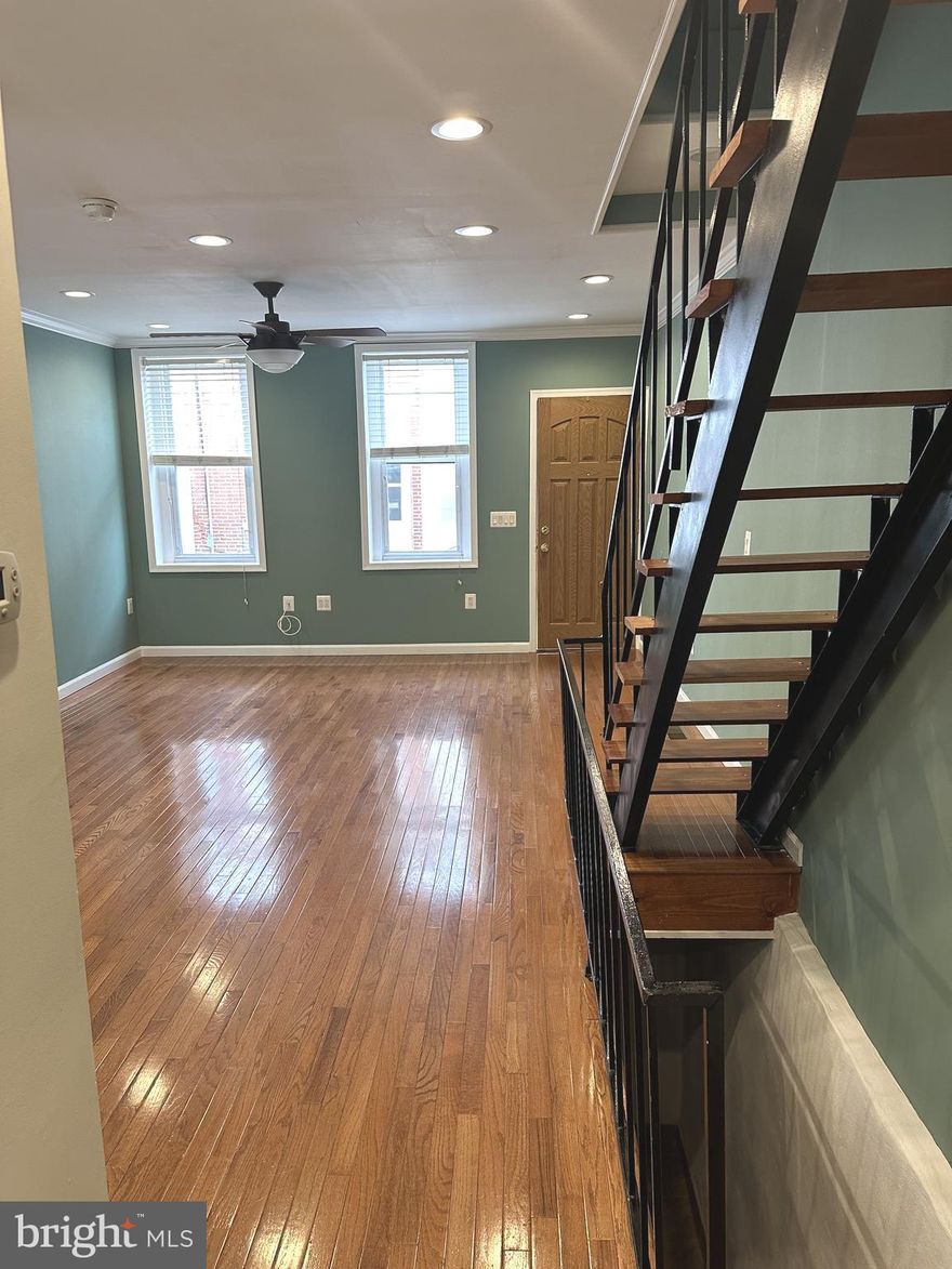 Welcome to this well-maintained 3-bedroom, 1-bath rowhome on a quiet block in Port Richmond, now offered at a reduced price with the seller open to concessions and assist for qualified buyers. This bright and inviting home features an open layout with recessed lighting, hardwood floors, and central air. The main level provides a comfortable living area and a practical kitchen with wood cabinetry, laminate countertops, and matching appliances. Upstairs offers two nicely sized bedrooms and a full bathroom with clean, modern finishes, while the finished basement functions as a true third bedroom with dedicated laundry and additional storage. Outside, a private rear patio with a built-in bar area creates the perfect space for relaxing or entertaining. Currently rented month-to-month for $1,625, this property delivers strong turnkey investment potential or a great opportunity for an owner-occupant looking for value and flexibility. All of this is located just minutes from I-95, public transit, local parks, grocery stores, and popular Port Richmond favorites like Nemi, Byrne’s Tavern, and neighborhood cafés.