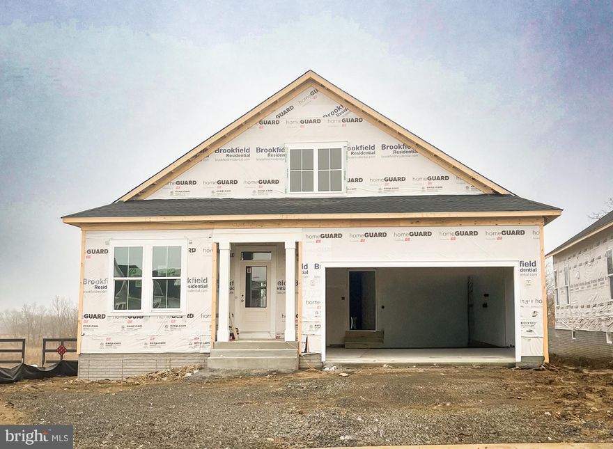 New, main level living home is under construction and will be ready this spring!! This Rockwell with 10 year builder warranty is located on a corner homesite, backing to open space, in Hiatt Pointe at Snowden Bridge, an active adult community for those 55 or better!
The stunning kitchen showcases Gourmet Stainless Steel Appliances with hood, white cabinets, quartz countertops, and an oversized butler's pantry. 
The main-level primary suite has been extended for additional space. It is complete with two large walk-in closets and a spacious deluxe bathroom with separate tub and shower with frameless door, along with two vanities with quartz countertops. Two additional bedrooms are just down the hall.  A dedicated laundry room is located conveniently just off of the garage entrance, with a pocket door to disguise the washer and dryer. A separate dining room or flex space is located at the front of the home and a screened in porch is located in the rear, to be enjoyed year-round. 
The lower level includes a large recreation room, a private guest suite and a full bathroom. There is a lower level exit to the backyard for convenience.
Community will offer a gated entrance, bocce & pickleball courts, clubhouse with event room, fitness and yoga studio, outdoor kitchen with gas grill and an outdoor pool with hot tub. Snow, trash and recycling included. 
Ask about special financing and closing costs assistance! 
Please note that interior photos are not actual and are only to showcase floorplan while home is under construction.