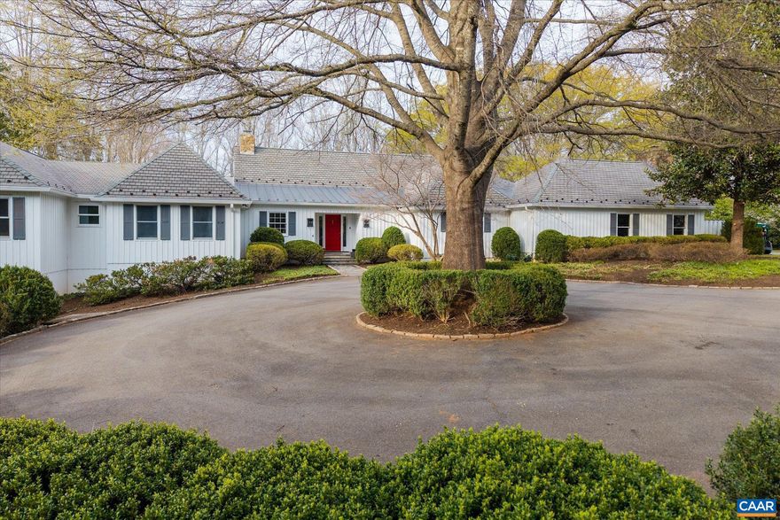 Classic 4 bedroom, 5.5 bath, one-story residence with a beautifully designed floor plan nestled in a pastoral setting on elevated 2.2 acres within the renowned & luxurious confines of Farmington Country Club. Spacious rooms, high ceilings, large windows, quality finishes, hardwood floors, outstanding flow and charm are just several of the cornerstones that define this lovely home. With over 5,800 finished square feet of living space, there is no shortage of inviting spaces to enjoy and live comfortably. Living room boasts a stunning stone fireplace, built by acclaimed stone mason Sheldon Sprouse. The dining room, family room and library are all well proportioned, have handsome working fireplaces, and flow out to a spacious deck and a private stone patio - perfect spots to entertain. Fully equipped kitchen, with stainless steel appliances and countertops, has adjoining breakfast room and walk-in pantry. All bedrooms are en-suite, including the primary suite with vaulted ceiling and an attached fully outfitted marble-tiled bath, plus massive closet. The lot is beautifully landscaped, offering delightful spaces for relaxation,  and possesses a most impressive Willow Oak, a stunning Zelcova, and other specimen trees and boxwoods.,Stainless Steel Counter,White Cabinets,Wood Cabinets,Fireplace in Dining Room,Fireplace in Family Room,Fireplace in Living Room