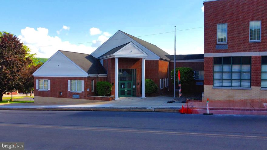 Location, location, location! On a large corner lot in the center of Curwensville sits this solid brick commercial building since 1900. Previously used as a financial institution, the first portion of the property offers over 7,437 ft² and is comprised of a vestibule, a large lobby, 5 offices, teller space, a vault, plenty of storage, two booths, two bathrooms, and elevator access which takes you to the basement level. The basement level offers ground-level access directly from the parking area, a large conference room, three storage rooms, tons of closets, a kitchen/ breakroom, a utility room, and two bathrooms. The second portion of this property is laid out in over 19,434 ft² and was previously used as a business building. The business building is comprised of three levels, the first offering 7 offices, training spaces, a vestibule, reception area, access from ground-level, tons of storage, four bathrooms, and a meeting room. The second level is comprised of 11 offices, three bathrooms, a vault, a kitchen/ breakroom, a conference room, 6 storage rooms, an ADA-accessible ramp, and elevator access. The third level features the basement containing even more storage space, two original vaults, and a kitchen/ breakroom. This entire property is served by 3-phase electric, a Generac generator, air conditioning, commercial heating systems, and 36+ parking spaces. This property will be transferred with deed restrictions, specifying restricted property uses. Call today for more information and to schedule your tour!