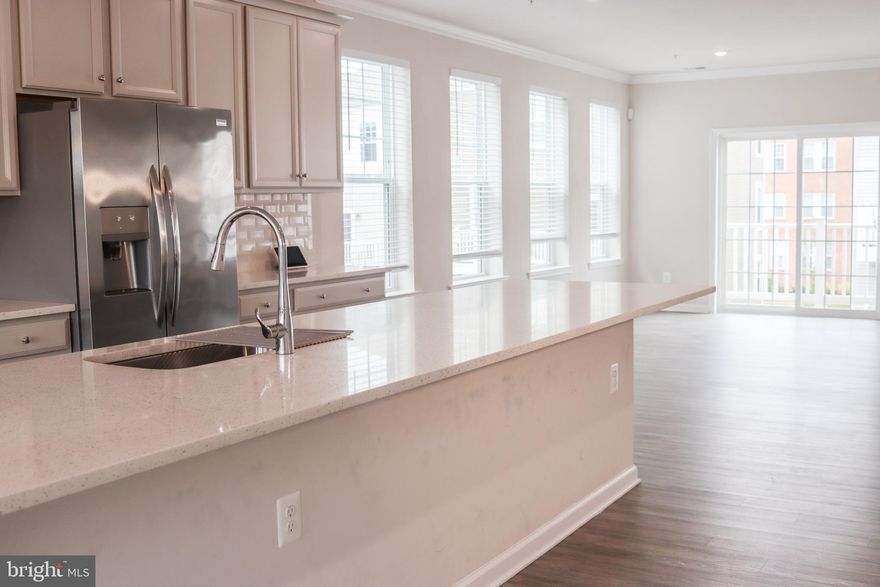 Explore this stunning Stanley Martin home boasting over 2700 sq ft across three beautifully finished levels. As you step into the main level, you are greeted by a bright and open floor plan featuring gleaming floors, custom tray ceilings, and artistically painted accent walls. The main area includes recessed lighting and a remarkable kitchen, complete with a large island—ideal for hosting and creating lasting holiday memories. This great room extends seamlessly into a dining area and opens to a spacious eat-in kitchen with access to a sizable deck, offering the perfect setting for peaceful mornings and relaxing evenings.

The upper level is home to three generously sized bedrooms, including an owner’s suite with a substantial walk-in closet and an en-suite bathroom. Additionally, this level enhances your living experience with the convenience of in-home laundry facilities. Located just minutes from the Landover Metro stop, New Carrolton station (servicing Amtrak, MARC, and the upcoming Purple Line), and within easy reach of Washington, D.C., this home offers excellent connectivity via I-495, Route 50, and the BW Parkway, placing you perfectly for commuting and exploring.