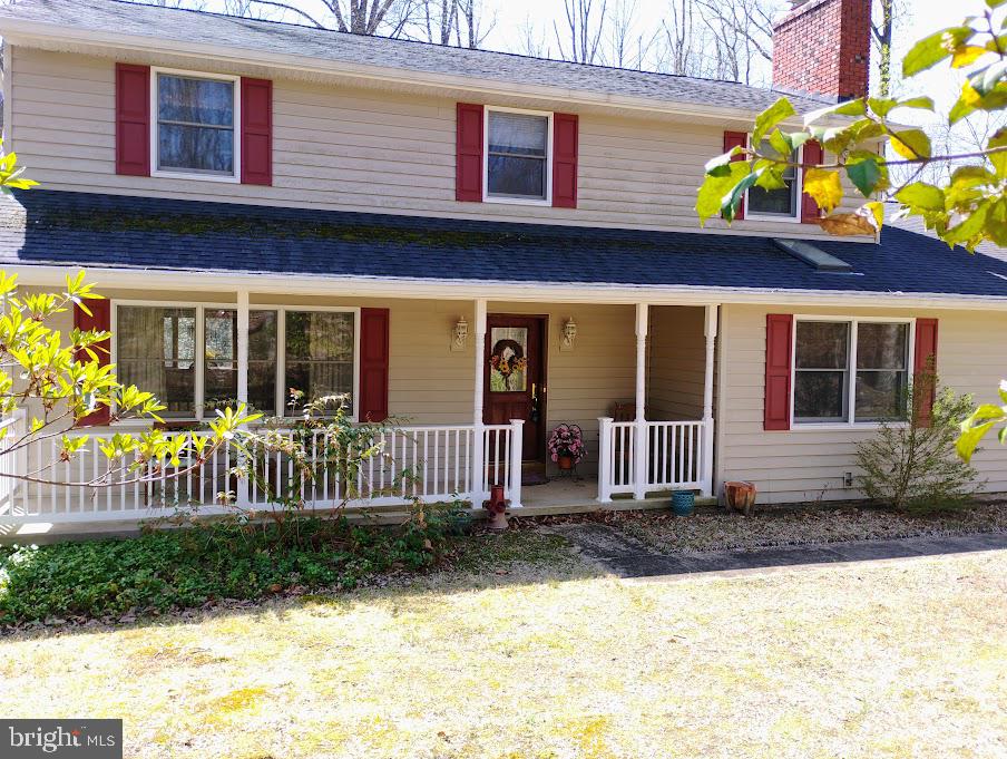 Unbelievable location! Your own private residence tucked away on just over 3 acres of tranquility. Home provides seclusion and convenience with nearby dining, parks and many waterways to enjoy just a short drive. The front porch is spacious enough to enjoy your serene space. As you enter into the foyer you may enjoy the family room that features a brick fireplace along with cherry stained wood floors and surrounded by natural light from the skylight or enter to the left into the formal living area with track lighting, cherry floors leading into the formal dining room with bay window overlooking the backyard and all the joys of nature. The spacious kitchen has wood cabinets along with quartz countertops and stainless & black appliances. There is lots of room for family and friends to gather enjoying a meal inside or outside on the screen porch or lower tiered deck with hot tub as the gathering continues to move to the sprawling outdoors. Also the first floor offers a laundry room with sink and exterior door to walk outside between chores. **Added Bonus is the in-law suite with full bath, double closets and its own private entrance. Heading upstairs the home features 3 nice size bedrooms with double closets and a hall bathroom with double vanity to share. **Check out the 4th and primary bedroom we have a newly updated bathroom with granite and walk in shower and for those cozy nights you have your own fireplace. Now downstairs we are ready for your own personal touches in the basement featuring a walk out slider and a empty slate to create your dream room but in the mean time there is a slate pool table or table tennis waiting for playing pleasure. Rough in for Bathroom in Basement....Under deck storage....Roof, Siding, gutters, soffitts and deck replaced in 2014..HVAC replaced in 2020 with remaining warranty... This home is ready to be yours to make memories! The community offers access to a private community beach. When you love where you live a must needed easy commute to Baltimore, DC, Annapolis and Fort Meade or need a flight to BWI....WELCOME HOME....Voluntary Community Association-$125 year granting access and key to community beach located on Eagle Hill, chain across entrance at 349,,SELLER IS OFFERING A $5,000 CREDIT FOR CARPET REPLACEMENT