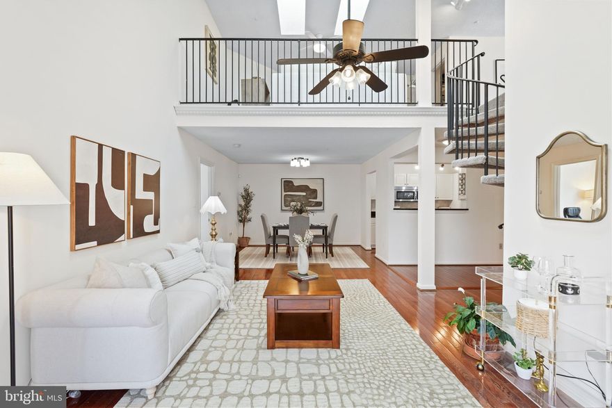 Discover the perfect blend of space and style in this rare, sun-drenched gem located in the heart of Germantown’s Churchill View community. This stunning top-floor unit immediately impresses with soaring vaulted ceilings and skylights that bathe the open interior in natural light. The main level features a semi-open kitchen with updated appliances that flows seamlessly into an airy, light-filled living room, extending out to a private balcony—ideal for morning coffee or evening relaxation.
The main floor offers three spacious bedrooms, including a primary retreat with a luxuriously updated en-suite and a large closet featuring custom built-ins.

Two additional bedrooms offer ample space and share a smartly updated bathroom conveniently situated directly between the two rooms. The home’s true showstopper is the expansive upper-level loft. This cozy bonus retreat features a warming gas fireplace, making it the perfect family room or home office. The loft adds significant value with a massive walk-in closet with built-ins and a separate extra storage room. Convenience is key with an in-unit washer and dryer located on the main level.

Community & Location Highlights
Living in Churchill View means enjoying a lifestyle of convenience and recreation. Residents have access to top-tier amenities, including sparkling community pools, tennis courts, and scenic walking paths that wind around nearby Lake Churchill. You are just moments away from the vibrant Germantown Town Center, BlackRock Center for the Arts, and a variety of dining and shopping options. Commuters will love the easy access to I-270 and the MARC train station.

To top it off, parking is stress-free with flexible options, including reserved spots for residents and plenty of visitor parking for guests.