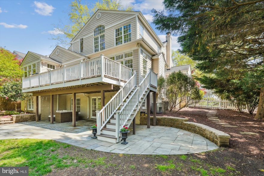 NEW PRICE- AMAZING OPPORTUNITY FOR A BUYER. With exceptional curb appeal and classic colonial architecture, this thoughtfully renovated and expanded residence is the perfect blend of timeless style and modern convenience. Captivating sight lines draw your eye through the home from the moment you enter, showcasing stunning views of the surrounding trees and natural landscape.

Backing directly to Rock Creek Park—a protected gem with scenic trails and a meandering creek—this home offers unmatched access to nature, just minutes from city conveniences.

The main level features a formal dining room, a living room with a wood-burning fireplace, a powder room, and a private office/library. A seamless addition created the heart of the home: a chef’s dream kitchen with a Viking range, walk-in pantry, wine refrigerator, and custom wood cabinetry. This space flows into a spacious family room with a second fireplace and a charming casual dining area under a vaulted beadboard ceiling—flooded with natural light and framed by walls of windows. Step out onto the expansive deck—ideal for gatherings and peaceful outdoor living. A custom mudroom with cubbies connects the garage to the home and offers a separate front entry, perfect for today’s busy lifestyle.

Upstairs, you’ll find four generous bedrooms and two full baths. The luxurious primary suite is a retreat of its own with soaring ceilings, oversized windows, a walk-in closet, and a spa-inspired bath featuring dual vanities and a soaking tub.

The walkout lower level is built for entertaining, with a bright recreation room, full bedroom and bath, a bonus room with new luxury flooring, and a well-appointed laundry room with Samsung appliances. Step outside to a covered flagstone patio and fully fenced, level backyard.

Located just a block from Rock Creek Park’s biking and walking trails, with easy access to shopping, Metro, and the amenities of Kensington, Bethesda, and Rockville, this is the forever home you’ve been waiting for—set in a serene, sidewalk-lined neighborhood.