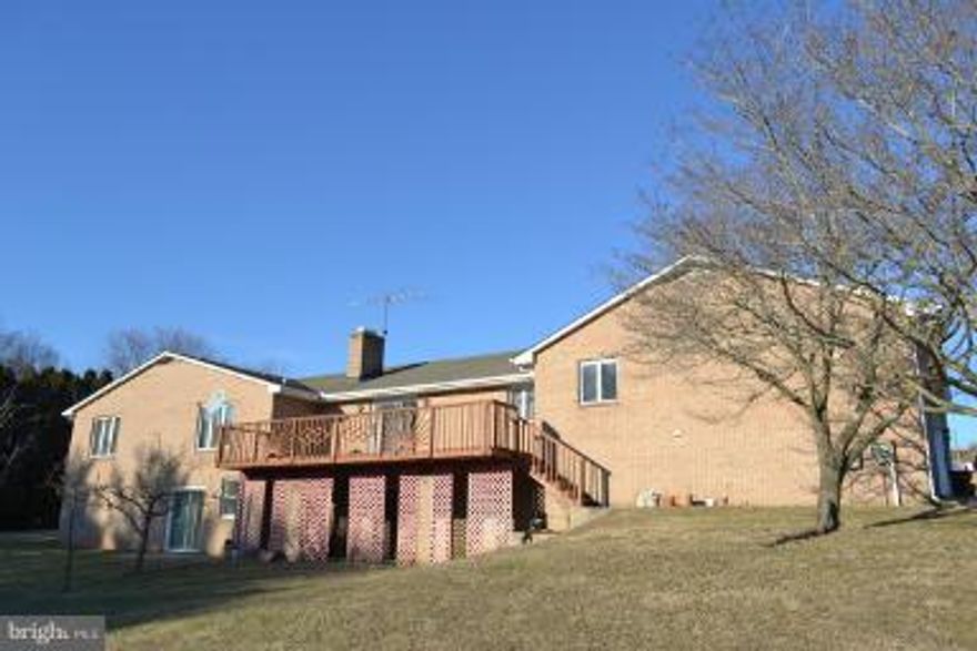 2+ acres! Well maintained ALL BRICK rancher! 7 bedrooms (use as offices/walking closet) Driveway w/Side Entry extra large Garage. 2 large finished open areas in basement, Andersen windows, Hardwood floor on main level. Large deck w/ patio. Perfect for large family, home office or business. 0.3 miles to FallSton Middle/high school. 0.6 miles to MTA bus station.Lovely home is ready for buyer move in