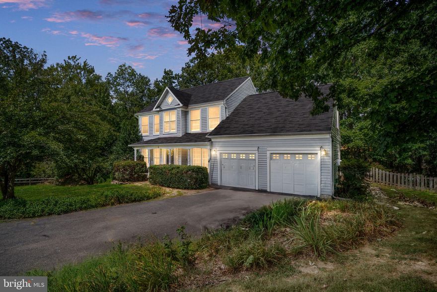 Rare find in Cardinal Forest! This 5-bedroom, 4-bath Colonial sits in a quiet cul-de-sac with over 3,000 finished sq ft and a private, wooded backyard. The main level offers hardwood floors, a spacious kitchen with granite counters, white cabinetry, and stainless steel appliances, plus a cozy living room with fireplace. Upstairs, the primary suite features vaulted ceilings and primary bath includes soaking tub and separate shower. The finished lower level includes a large rec room, an additional bedroom, and a full bath. Enjoy outdoor living with a screened porch, deck, and patio—perfect for relaxing or entertaining.