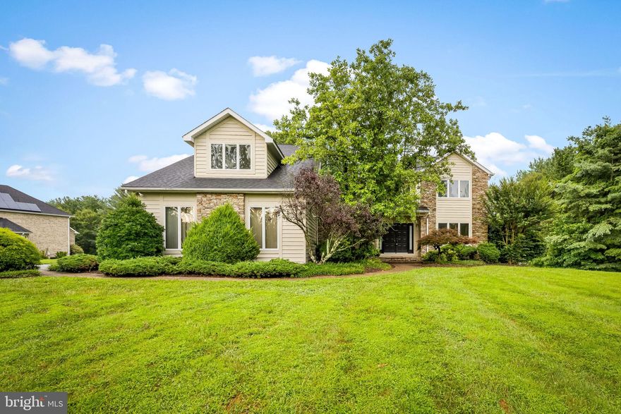 Perched atop an oversized 1.35-acre corner lot in the coveted Worthington Park community, this lightly updated and well-maintained 4 Bed / 3.5 Bath Colonial features 3,200 above grade SQFT with a deep, unfinished 1,460 SQFT basement and rear walk out offering additional finishing options, an attached two-car garage, rear deck, and long private driveway. Freshly painted and naturally lit throughout, the main level boasts a sunken family room with hardwood floors, entertainment built-ins, and wood burning fireplace, a dining and living room combo off the kitchen, and a kitchen / dining combo with peninsula counter, stainless steel appliances, and double oven built-in, along with a dedicated laundry room and half bath. The expansive second level has four spacious bedrooms, one den/study, three full bathrooms, and a primary suite complete with half vaulted ceilings, walk-in closet, and primary bath equipped with a soaking jacuzzi tub, stall shower, and expansive double sink. Architectural shingle roof installed 2020. With its easy access to major commuting routes like I-795 and I-695, as well as a variety of nearby conveniences, including shopping centers, restaurants, parks and trails, and recreational facilities, Worthington Park is perfect blend of convenience and comfort in a connected location!