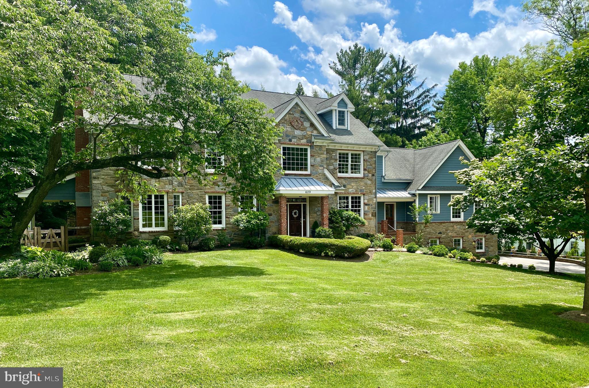 Stunning Northside Villanova home w/ 4 spacious levels for everyday living & entertaining. The 1st floor includes a gourmet Kitchen w/ adjacent Breakfast Rm, formal Living Rm, Study, expansive Fam Rm, Reception Rm & an impressive in-law suite w/ BdRm, Bath + Living - Kitchen area. Oversized windows flood sunlight throughout while French Doors provide access to the expansive deck. The 2nd level has a luxurious Owner s Suite w/ Sitting Rm & Spacious Bath + 3 additional BdRms, 2 Full Baths & Laundry. The walkout lower level, w/ access to the 3 car Garage, leads to the level rear yard. It is complete w/ Entertainment areas, Gym, Powder Rm, and finished storage room & closets. The 4th floor space can be a playroom, bedroom suite, office or more. You will find large spaces and custom millwork throughout. Conveniently located to major roadways, public transportation, shopping, restaurants and award winning Lower Merion Schools. Don't miss the joy of living in this wonderful home!
