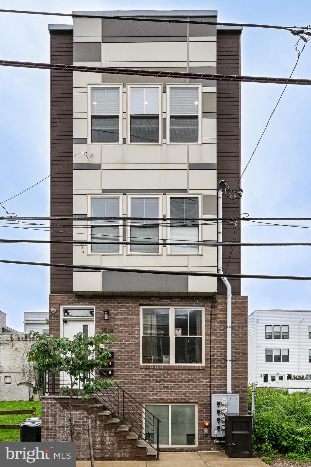 Exclusive Mortgage Offer, 1% off the buyer's rate for a full year! TAX ABATEMENT! Condo in a boutique building with full roof deck in Brewerytown. Enter the building via the common hallway and the unit is on the 2nd floor. Once you are inside the unit, there is a private staircase into a spacious living/kitchen area with high ceilings and solid red oak flooring throughout with a floor-to-ceiling window. The kitchen boasts solid wood cabinetry with soft close, granite countertops, a double bowl stainless sink, stainless GE appliances, and a peninsula that seats 5+ people. The full-sized French door refrigerator has a water dispenser and icemaker. The dishwasher has a stainless interior and the range is an electric glass-top. A micro-hood is included. There is a pendant light over the sink area. Down the hall, you'll find the full bath that has a soaking tub, wood cabinetry, and oversized tile on the floor, tub area, and wall. The spacious main bedroom has 3 large double-hung windows and two ample closets. The second bedroom has a large closet and two double-hung windows. The laundry is in the hall and boasts a stackable full-sized GE steam washer and dryer. There is a staircase within the unit to take you up to the private roof deck with panoramic views of the city. This condo has recessed LED lighting throughout. There are over 4 years left on the full 10 year tax abatement.