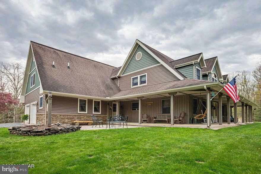 Experience unparalleled privacy and natural beauty in this sprawling country estate. Situated on 51+ acres, this home offers a rare blend of refined living and rugged outdoor adventure. A thoughtfully designed floor plan featuring 4 generous BRs and 4 modern BAs provides ample space for family and guests alike. The lower level with its cozy family room, office, workout room, workshop and kitchen area plus lots of storage is a bonus! Step out onto expansive porches and patios-perfect for morning coffee or hosting sunset gatherings overlooking your domain. The jewels of the property are two private ponds, offering opportunities for fishing or peaceful reflection. This entire property has been meticulously maintained and offers a level of tranquility that is increasingly hard to find. Contact listing agent Julia Randall (570)447-1300