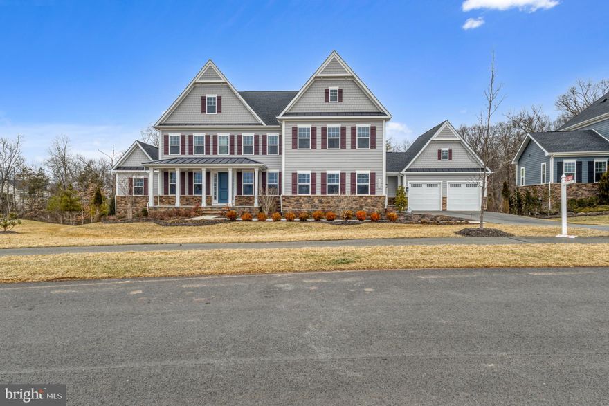 Welcome to the most desirable community in Northern Virginia – welcome to Hartland.
Step inside to the sophisticated NV Torrington Model Home.
Over $400,000+ Worth of Upgrades included in this Torrington Model Home.
2 Bedrooms in Main level, In-Law Suite First Floor and Additional Bedroom First Floor.
Washer/Dryer both in main level and upper level.
Covered Porch and Trex Deck.
Finished Basement with Rough-in for WetBar etc.
4 Car Garage with plenty of lights and Garage EPoxy flooring.
Lawn Irrigation / Sprinkler System
Trinity Wiring Security System Throughout the House.
From the stone front porch to the interior, every detail reflects unparalleled elegance. 
The main level boasts a professionally designed unique floor plan, two-story family room a redesigned bathroom with new vanity and modern lighting. 
The kitchen is a chef's delight, with 2 large islands, a six-burner stove, double ovens, dual dishwashers, and a butler's pantry, leading to a covered back porch that invites you to the magnificent outdoors. 
The main level also offers 2 bedrooms for both owners and in-law suite as well.
The primary bedroom is a true oasis, complete with a dedicated washer/dryer provision as an added bonus along with a peaceful retreat for those quiet moments and enchanting views of the surrounding landscape. 
Inside, you'll find spacious walk-in closets that offers ample storage space for your wardrobe and belongings. 
The primary bathroom is a true showcase, featuring a glass-enclosed shower, dual vanities provide the utmost convenience for busy mornings, while a spa tub invites you to unwind and indulge in a relaxing soak after a long day.
But the top-level experience doesn't stop there. An additional bonus living area on the upper floor offers the flexibility to cater to your family's unique needs. 
Whether it's a designated space for homework, a hangout for friends and family, or simply a tranquil spot for relaxation, this bonus area serves as a versatile haven within your home. 
With four en- suite bedrooms on the top level, this home ensures that your family's needs are not only met but exceeded.  This basement is fully finished and ready for entertainment, comfort, and practicality and plenty of opportunities to redesign them based on the buyer needs.
Truly a last opportunity to own an estate home in the heart of Hartland.